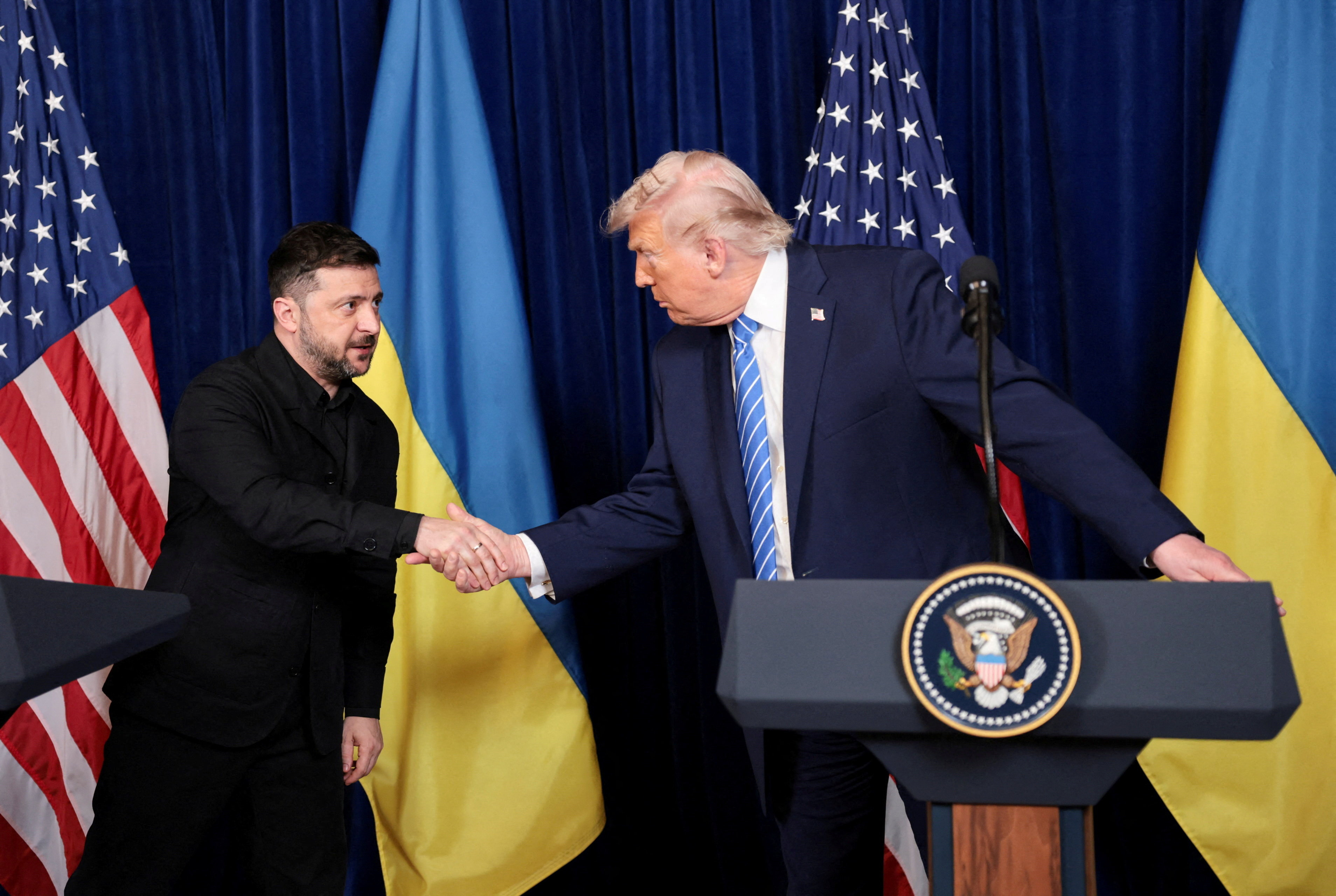 U.S. President Donald Trump and Ukrainian President Volodymyr Zelenskiy shake hands during a press conference after their lunch meeting at Trump’s Mar-a-Lago club, in Palm Beach, Florida, U.S., December 28, 2025.