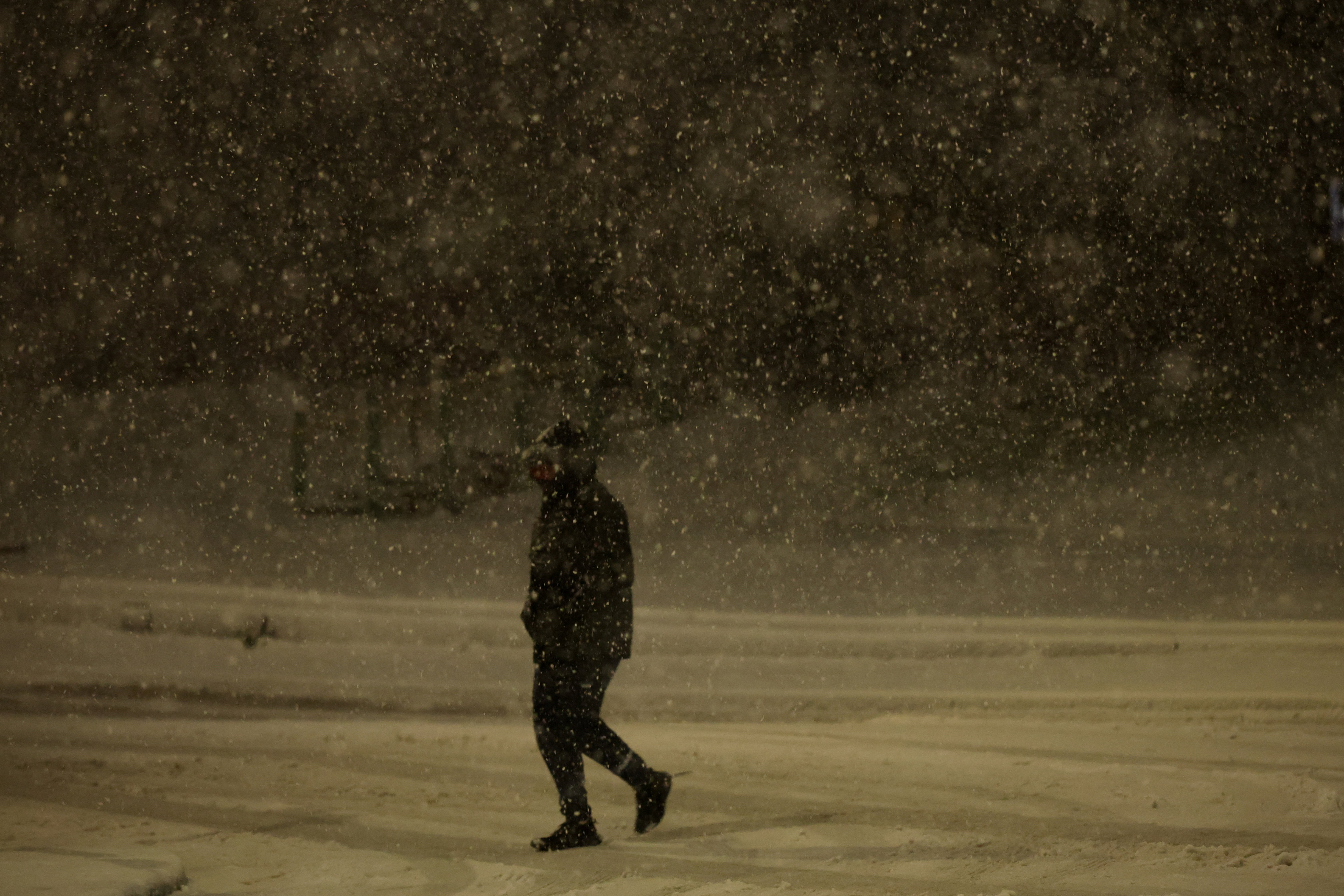 A person walks through the snow as Storm Goretti brings heavy snowfall and rain to Walsall, Britain, January 8, 2026.