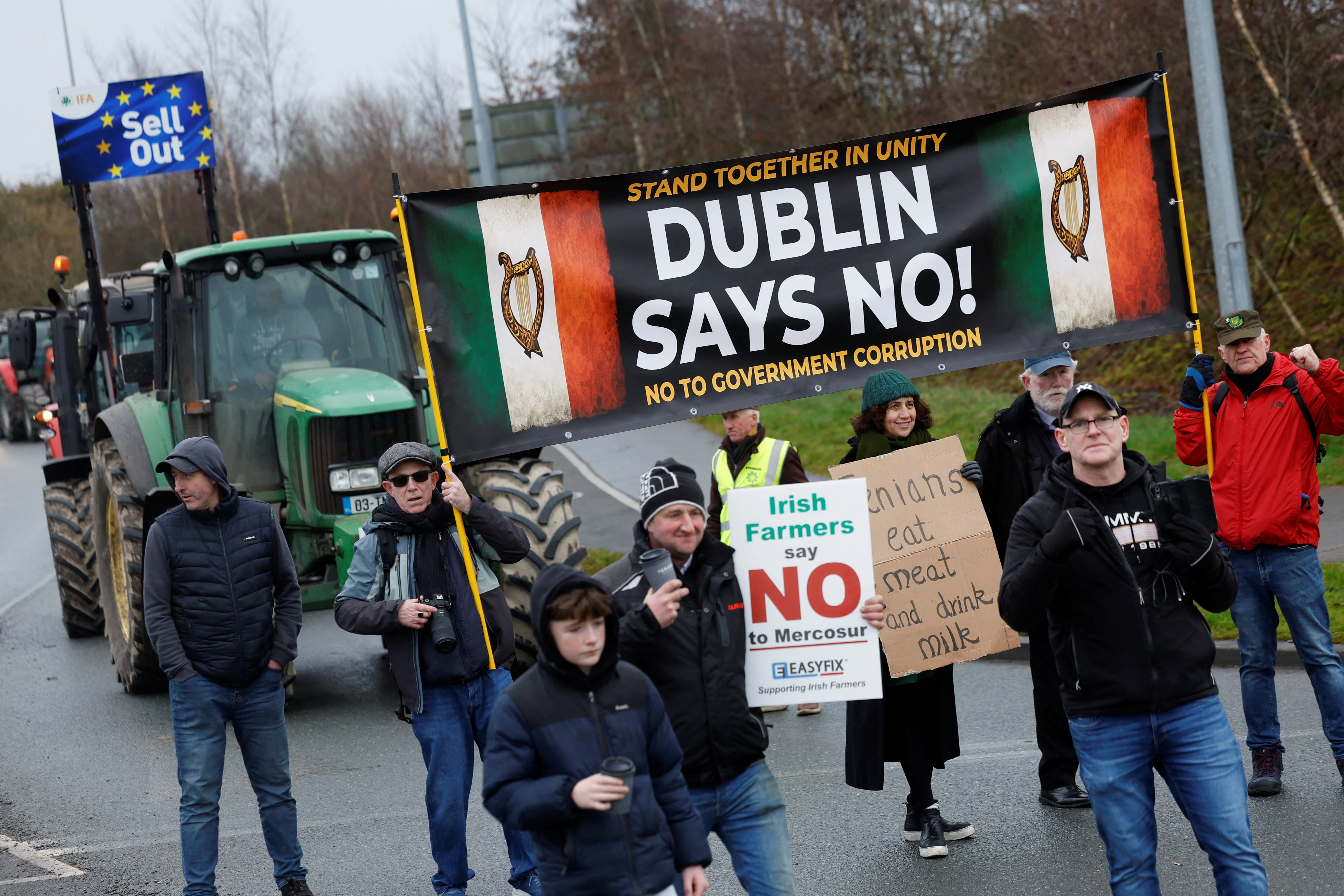 Demonstrators hold a banner and signs as they take part in a farmers' protest against the EU-Mercosur free trade agreement, in Athlone, Ireland, January 10, 2026. REUTERS/Clodagh Kilcoyne