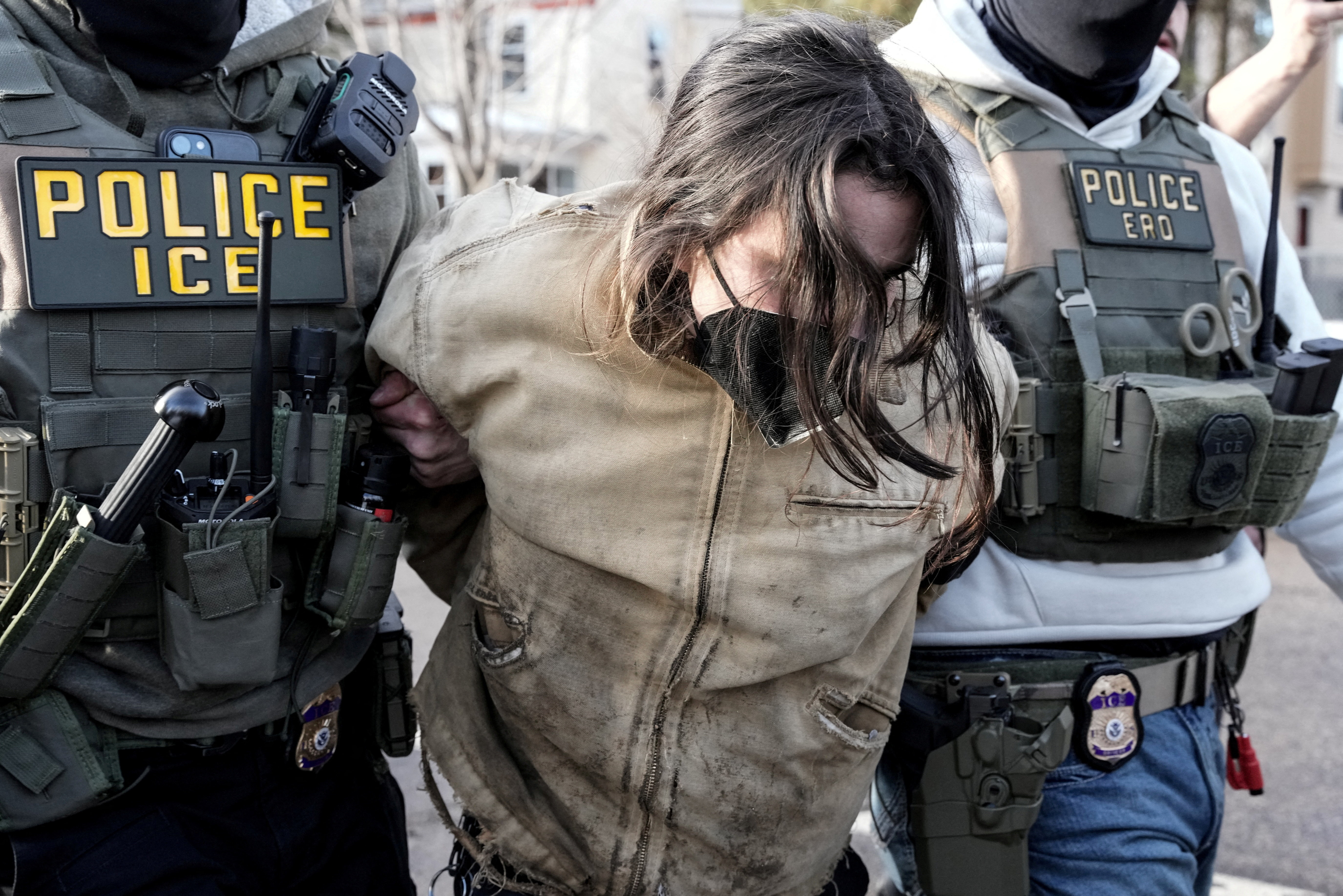 Federal agents detain an observer, days after an ICE agent fatally shot Renee Nicole Good, in Minneapolis, Minnesota, U.S., January 13, 2026.