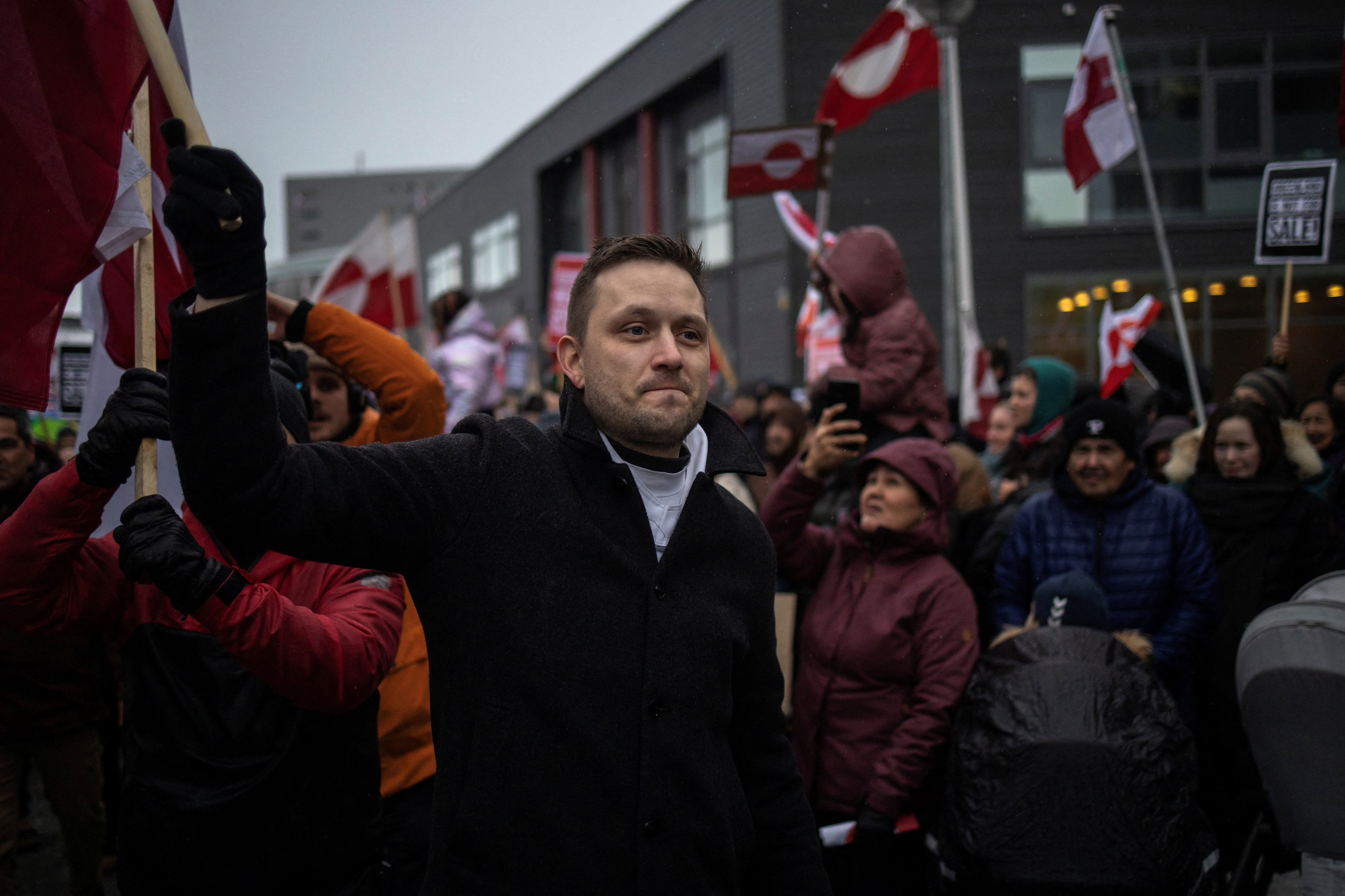 Greenland's Prime Minister Jens-Frederik Nielsen walks with people during a protest against U.S. President Donald Trump’s demand that the Arctic island be ceded to the U.S.
