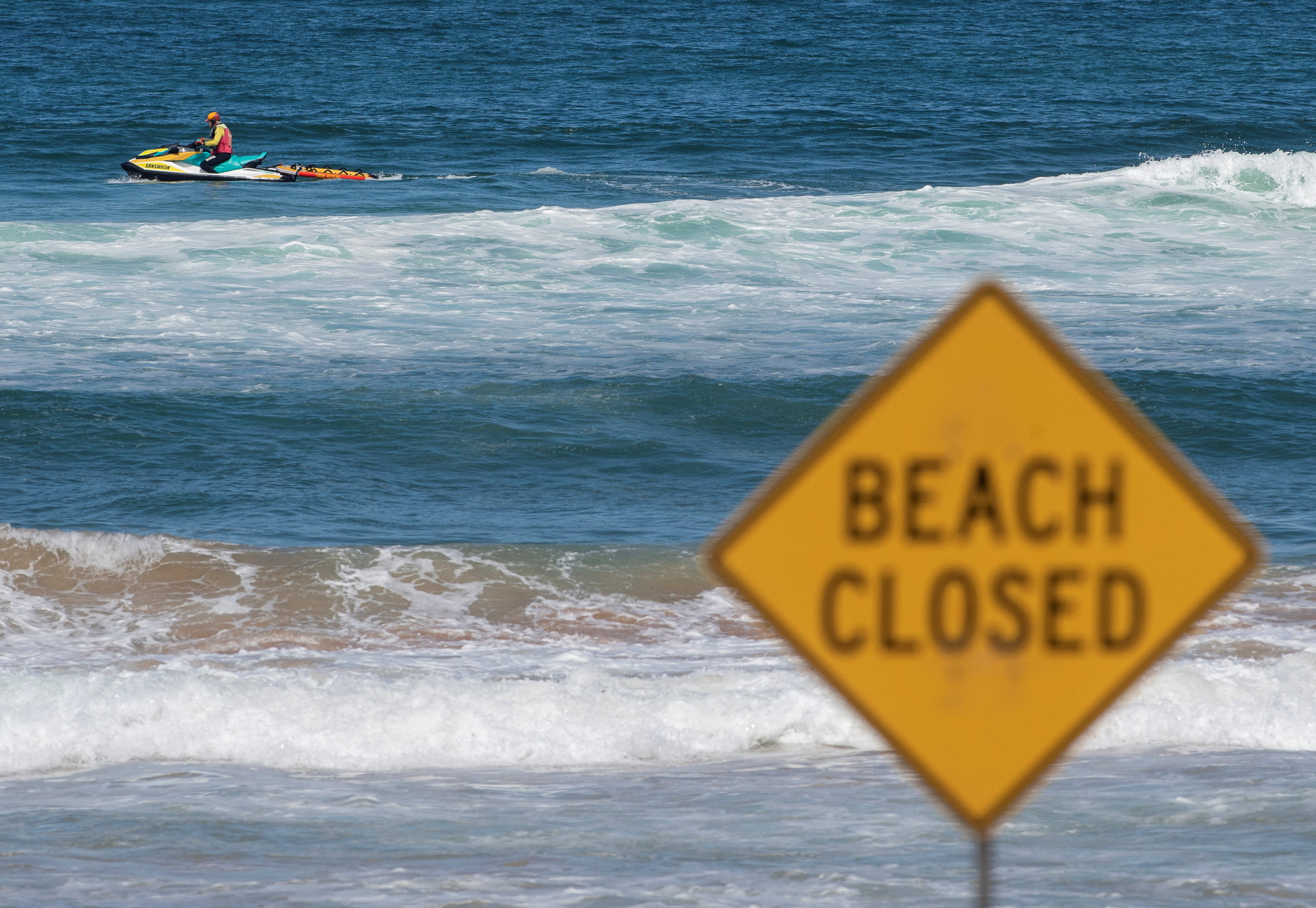 A lifeguard patrols North Steyne beach as beaches are closed after recent shark attacks, in Sydney, Australia, January 20, 2026. REUTERS/Jeremy Piper