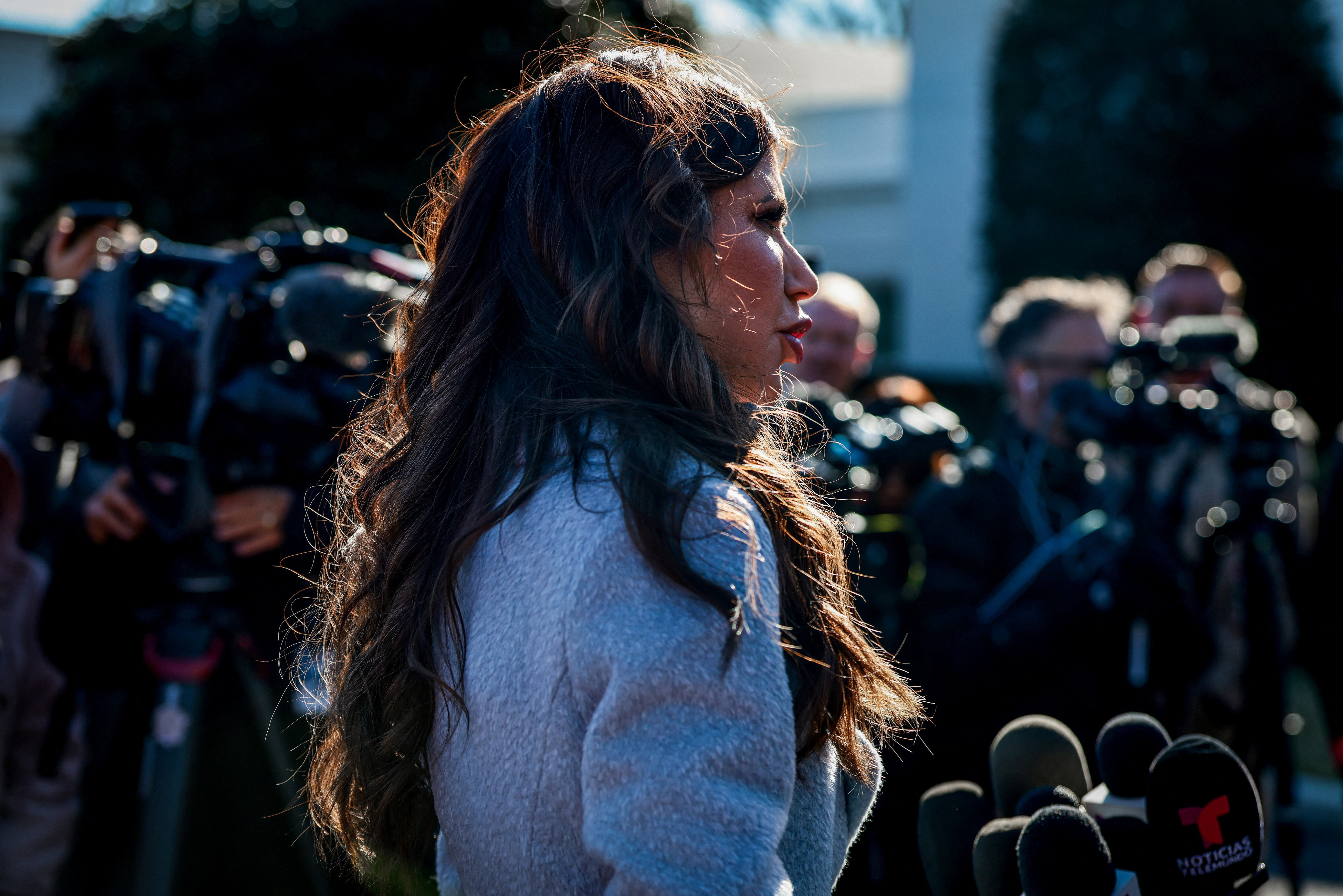U.S. Homeland Security Secretary Kristi Noem speaks to the media outside the White House in Washington, DC. U.S., January 15, 2026. REUTERS/Evelyn Hockstein