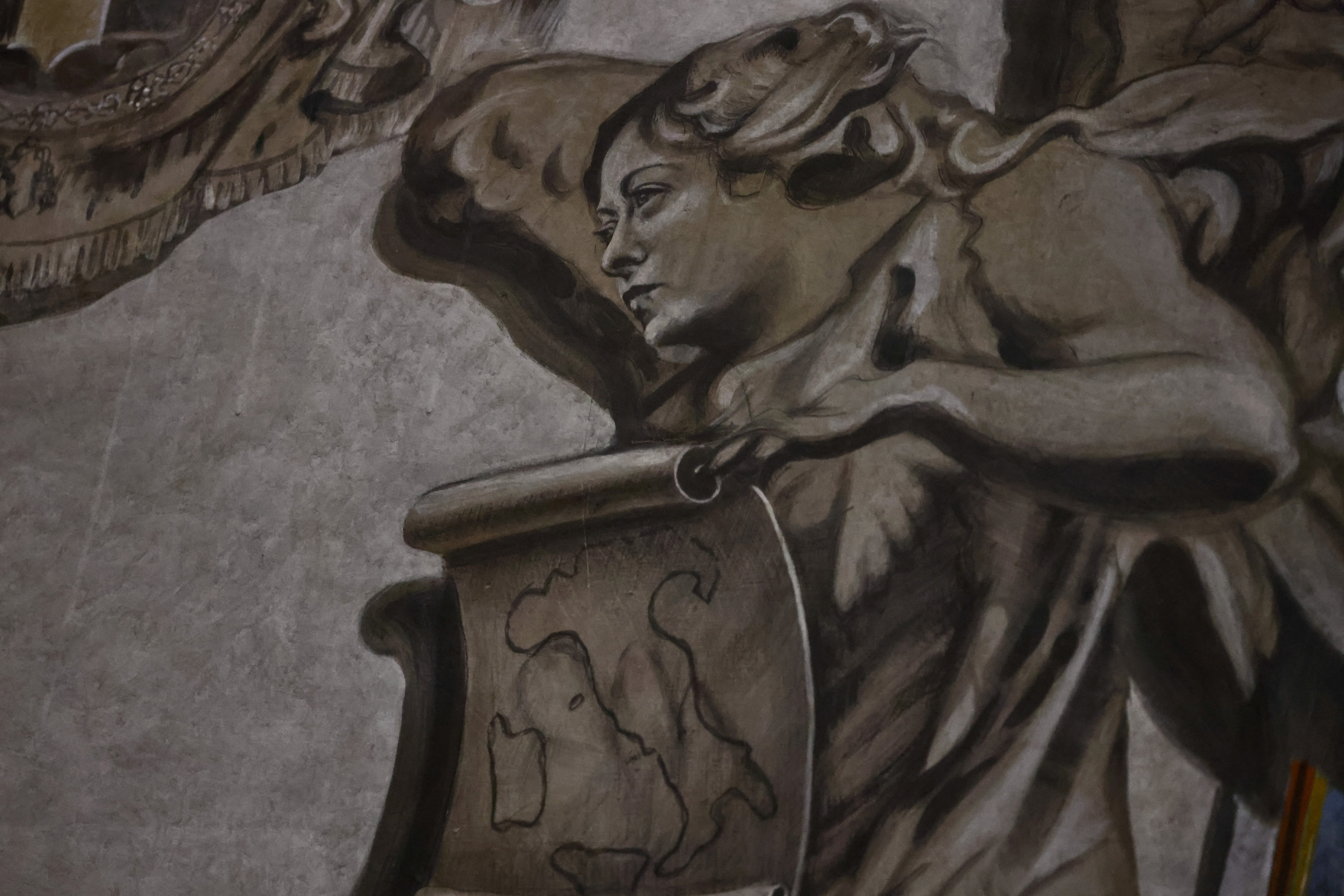 A restored angel fresco is displayed inside the Basilica of St. Lawrence in Lucina