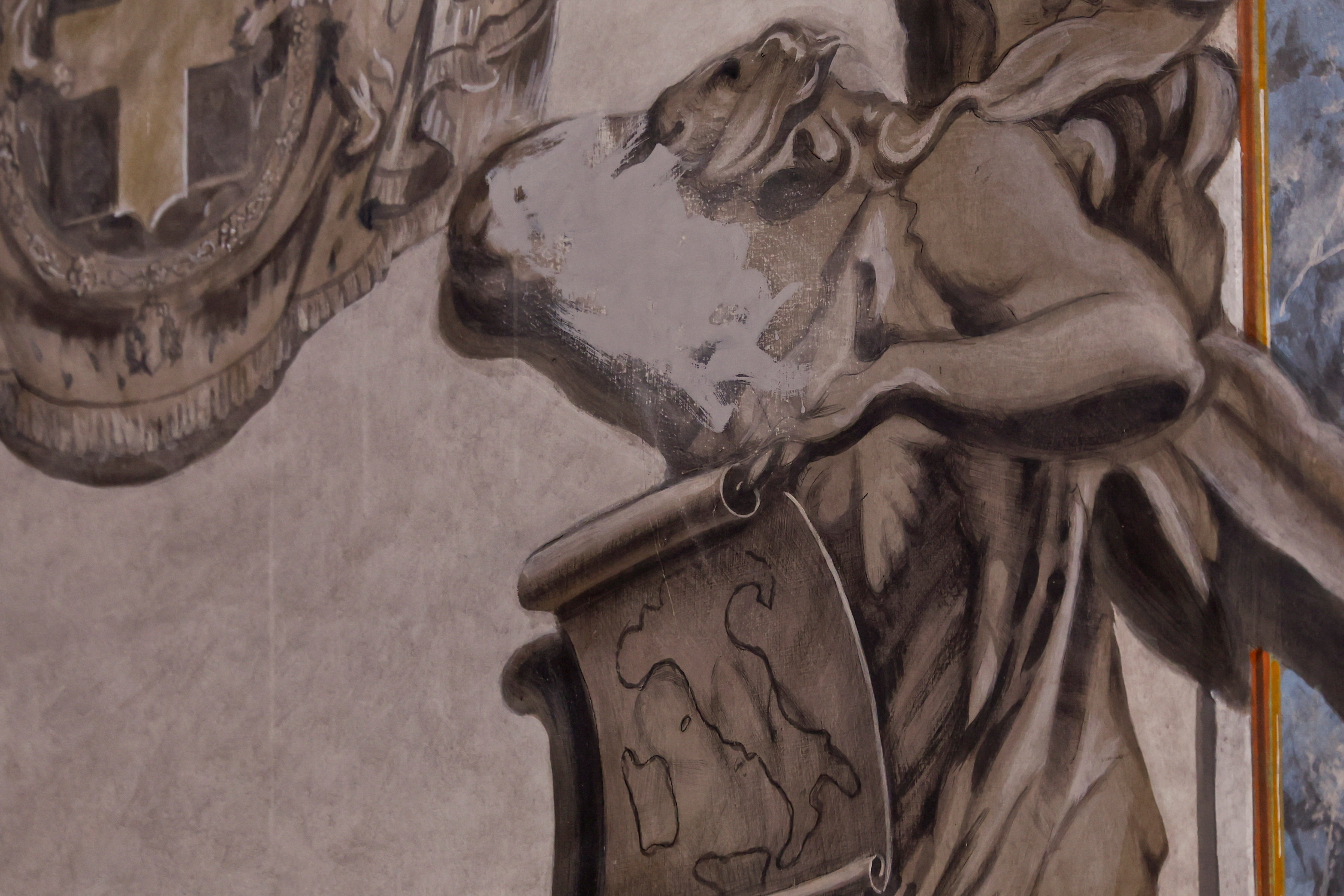 An apparent likeness of Italian Prime Minister Giorgia Meloni on an angel fresco painting is covered, after sparking political and clerical controversy