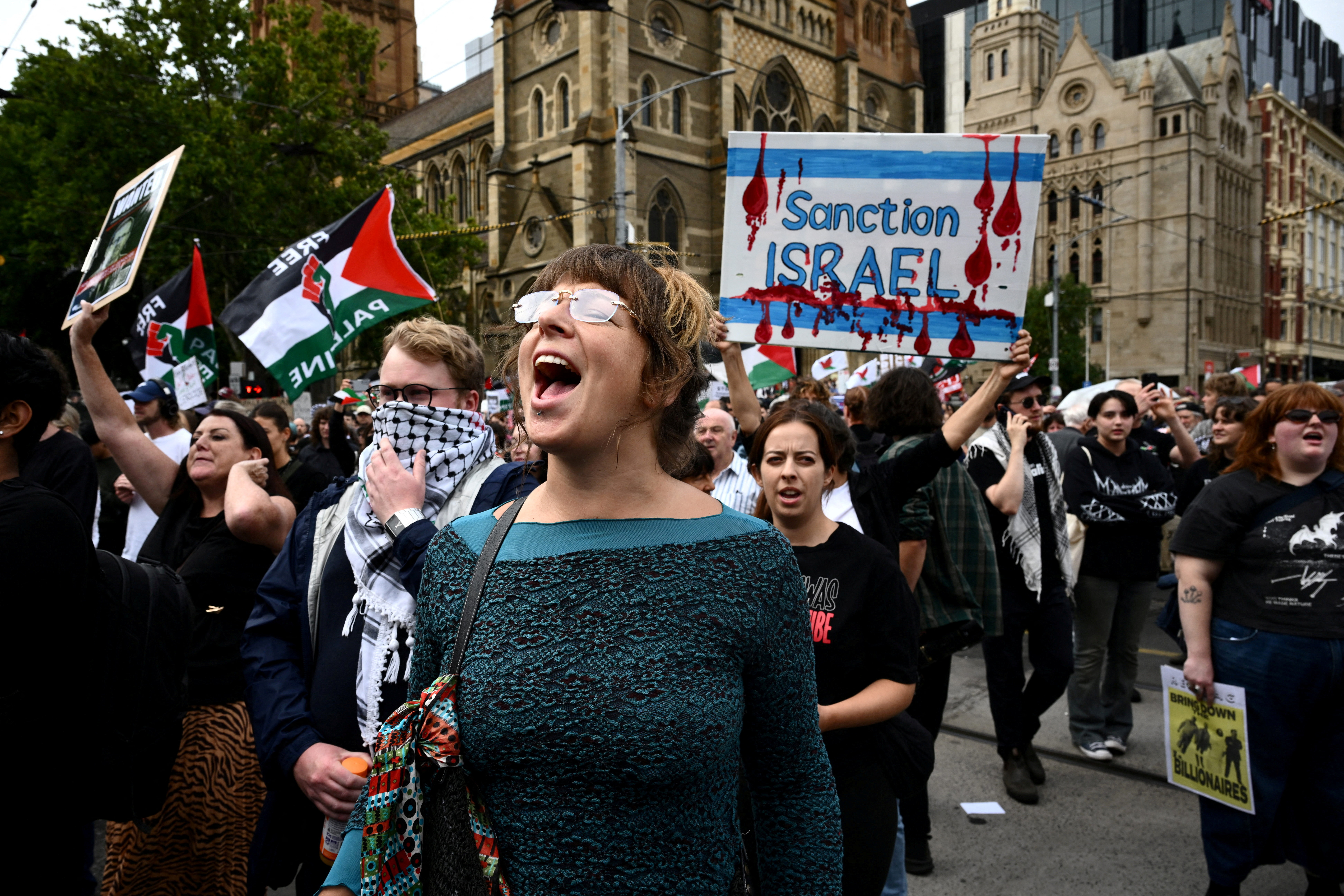 Demonstrators gather during a protest against Israeli President Isaac Herzog's visit to Australia, at Flinders Street Station in Melbourne, Australia, February 9, 2026.