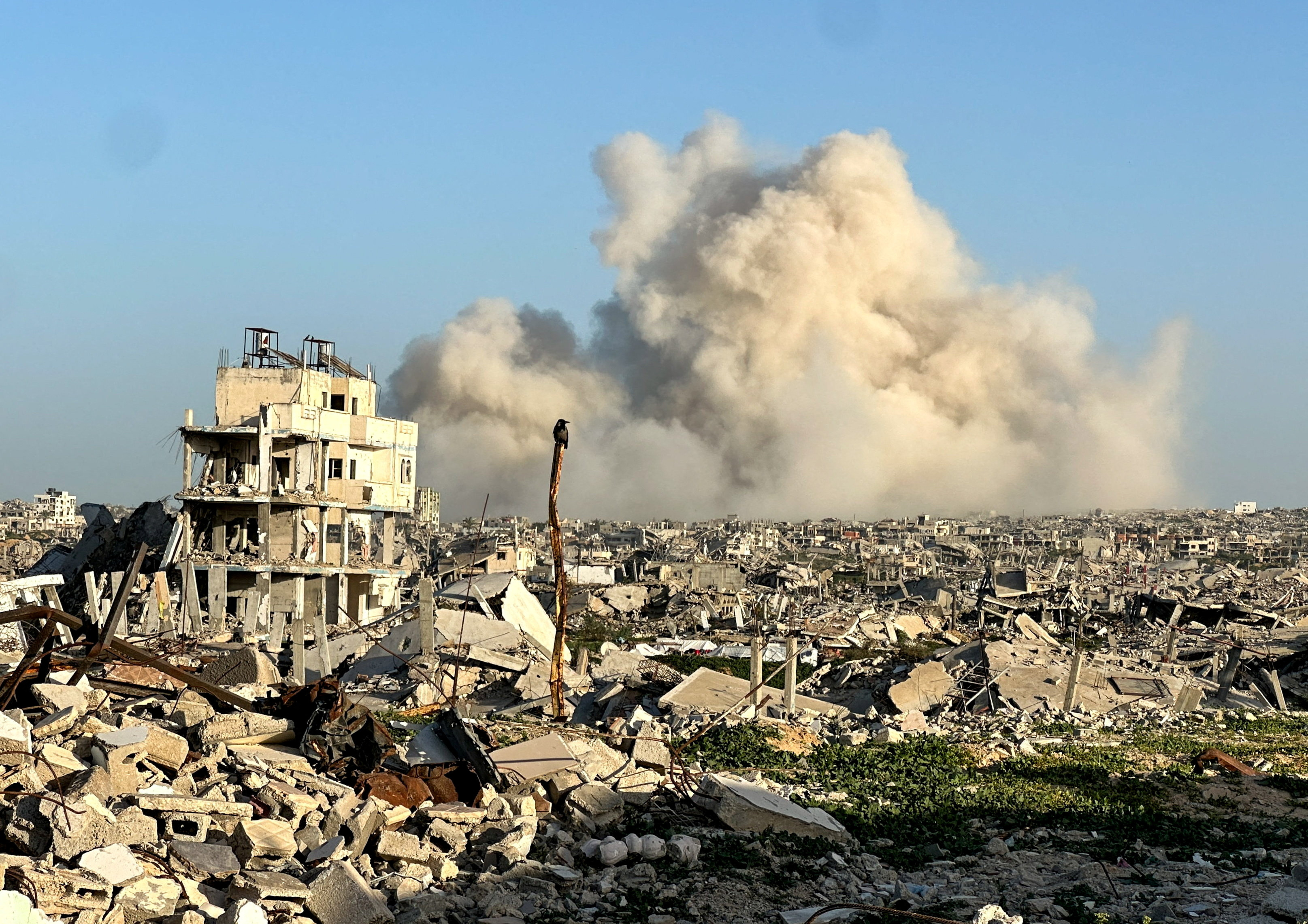 FILE PHOTO: Smoke rises following an explosion, within the "yellow line" zone, which is controlled by Israel, in Khan Younis in the southern Gaza Strip, February 10, 2026. Picture taken with a phone. REUTERS/Haseeb Alwazeer/File Photo