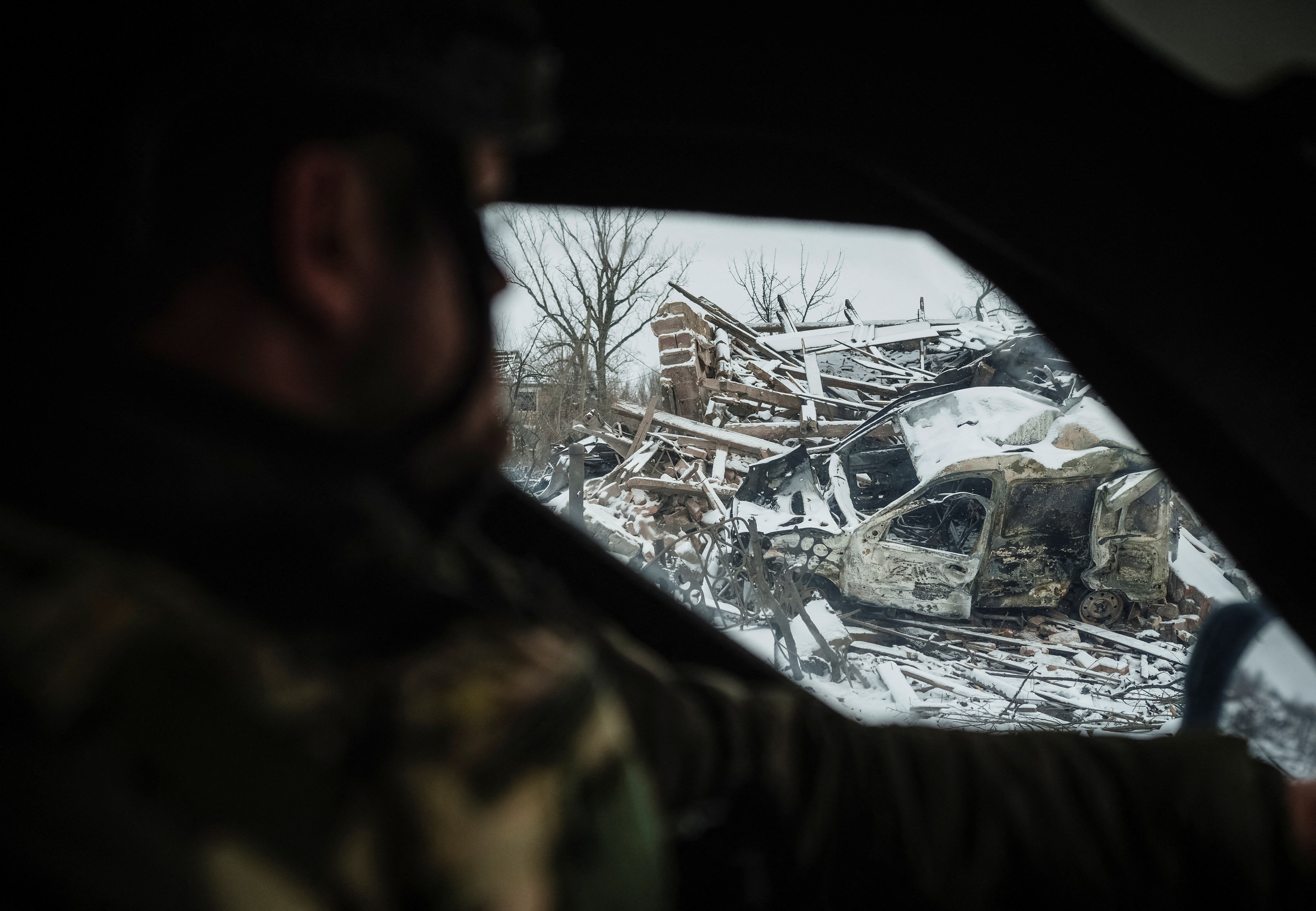A member of the White Angels police evacuation unit rides in an armoured vehicle during an evacuation from the town of Druzhkivka, amid Russia's attack on Ukraine, in Donetsk region, Ukraine January 24, 2026. REUTERS/Serhii Korovainyi
