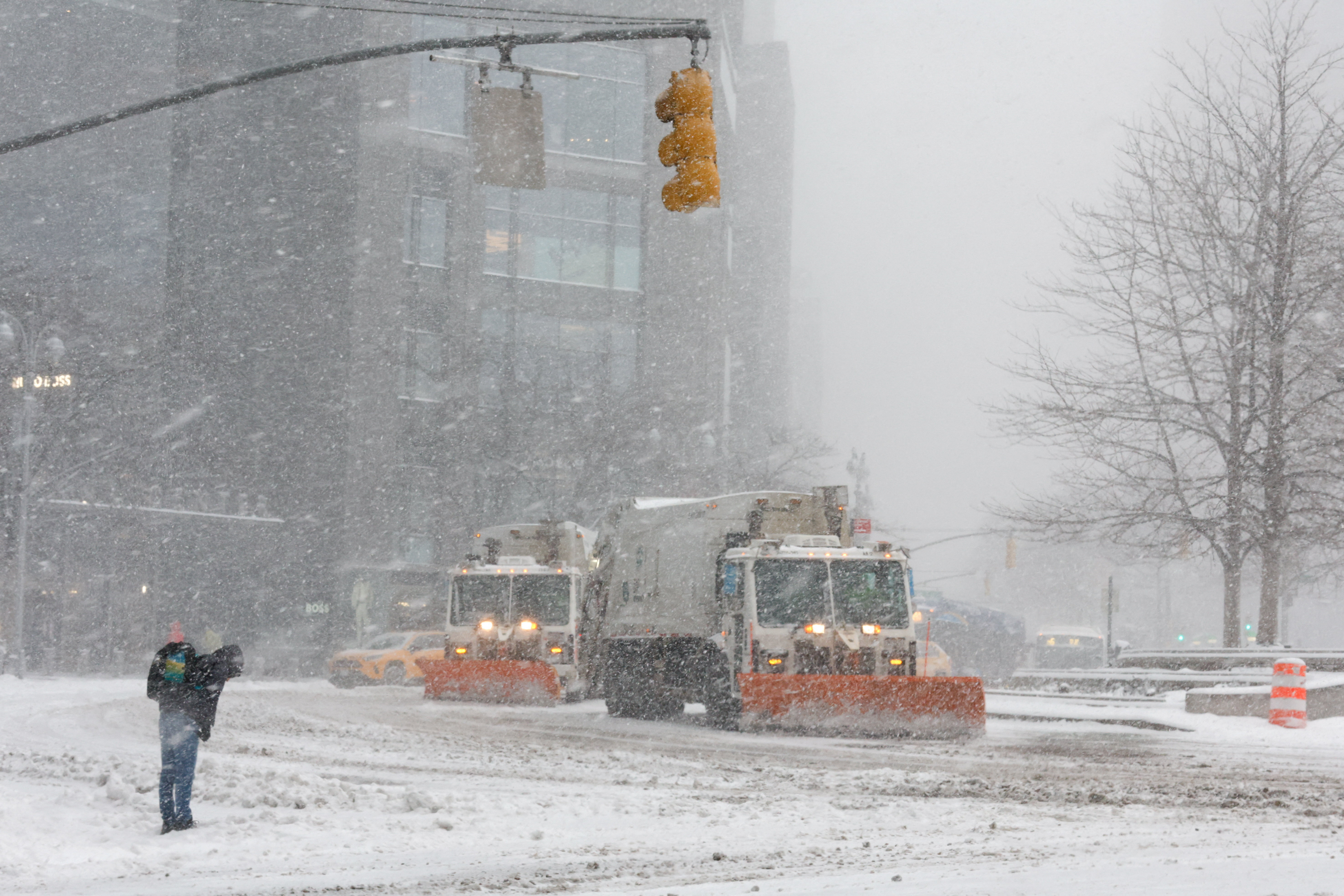 Snowplows clear the snow on the streets around Columbus Circle, as a major winter storm spreads across a large swath of the United States, in New York City, U.S., January 25, 2026. REUTERS/Eduardo Munoz