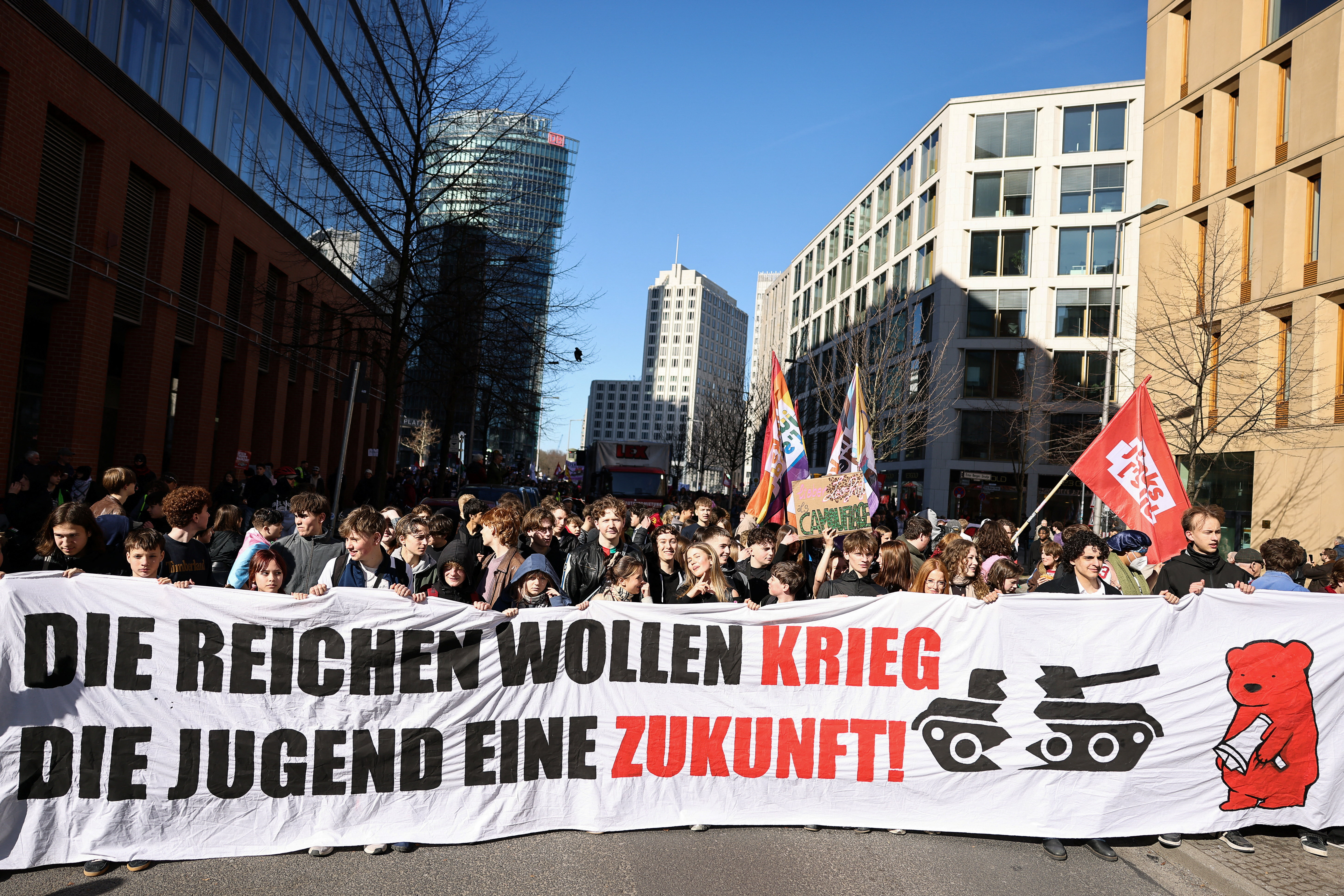 Demonstrators hold a banner that reads "The rich want war, the youth wants a future" during a protest against the potential return of military conscription in Berlin, Germany, March 5, 2026.