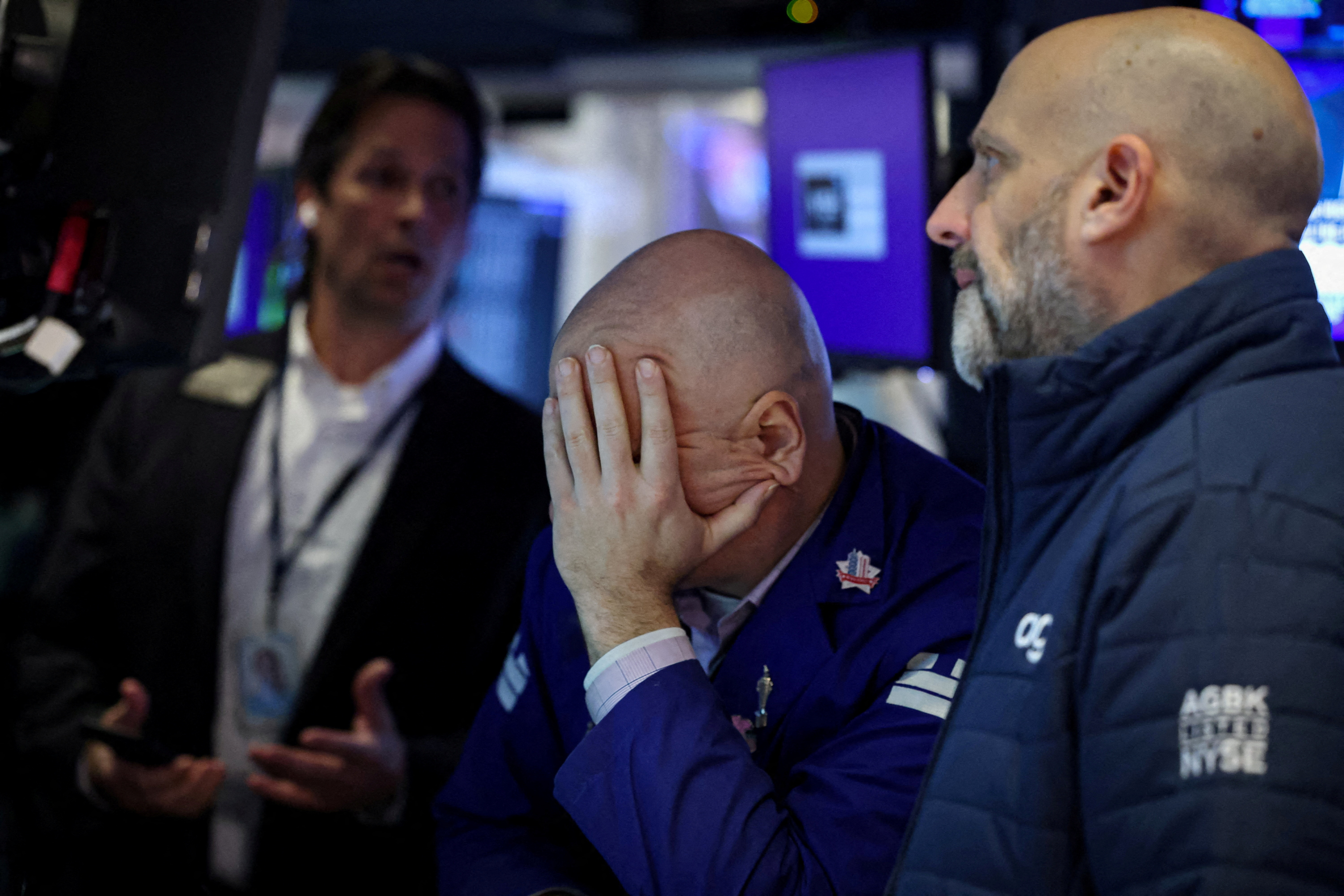 FILE PHOTO: Traders work on the floor at the New York Stock Exchange (NYSE) in New York City, U.S., February 11, 2026.  REUTERS/Brendan McDermid/File Photo