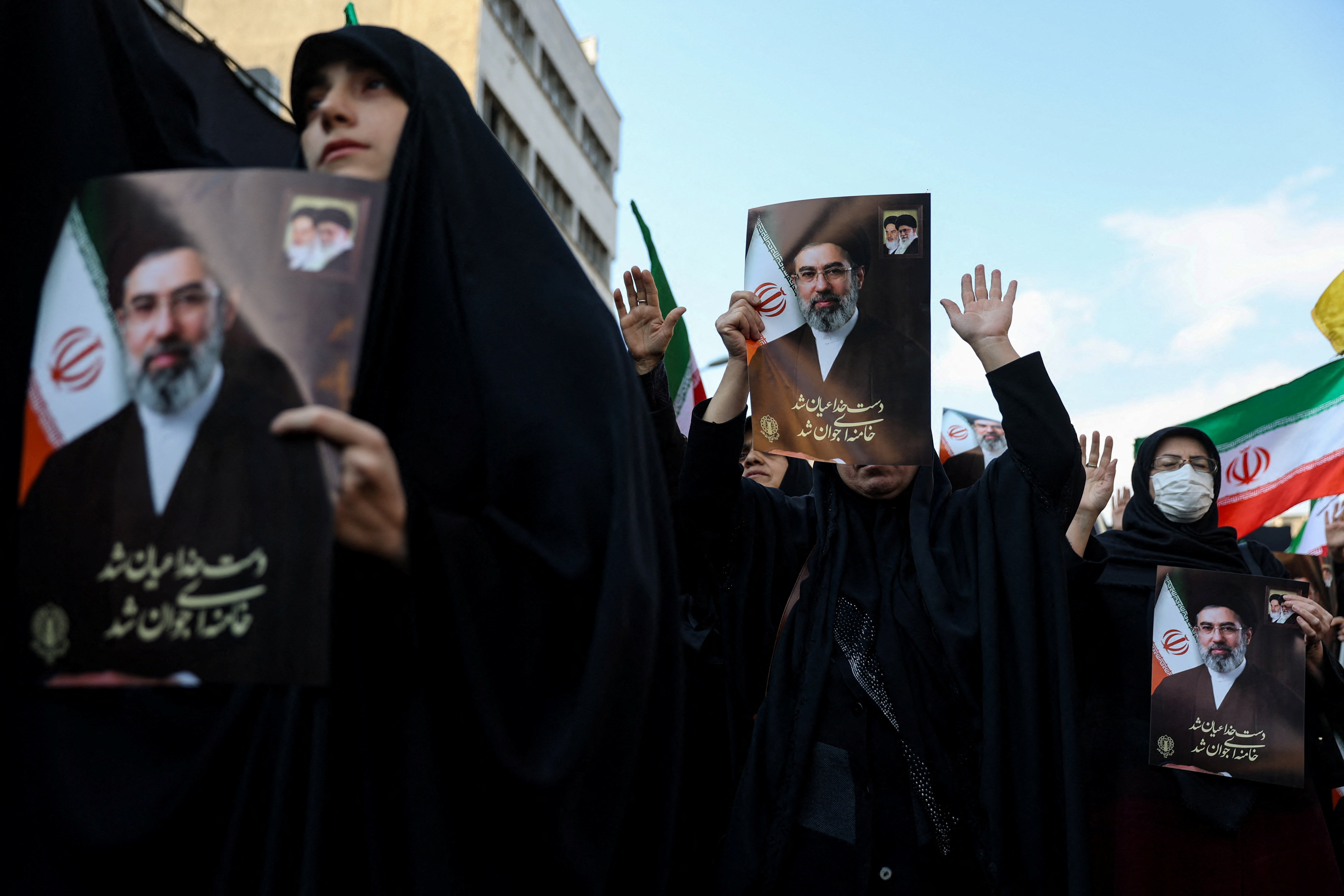 People hold placards with images of Iran's new supreme leader Mojtaba Khamenei March 9, 2026. Majid Asgaripour/WANA (West Asia News Agency) via REUTERS ATTENTION EDITORS - THIS PICTURE WAS PROVIDED BY A THIRD PARTY