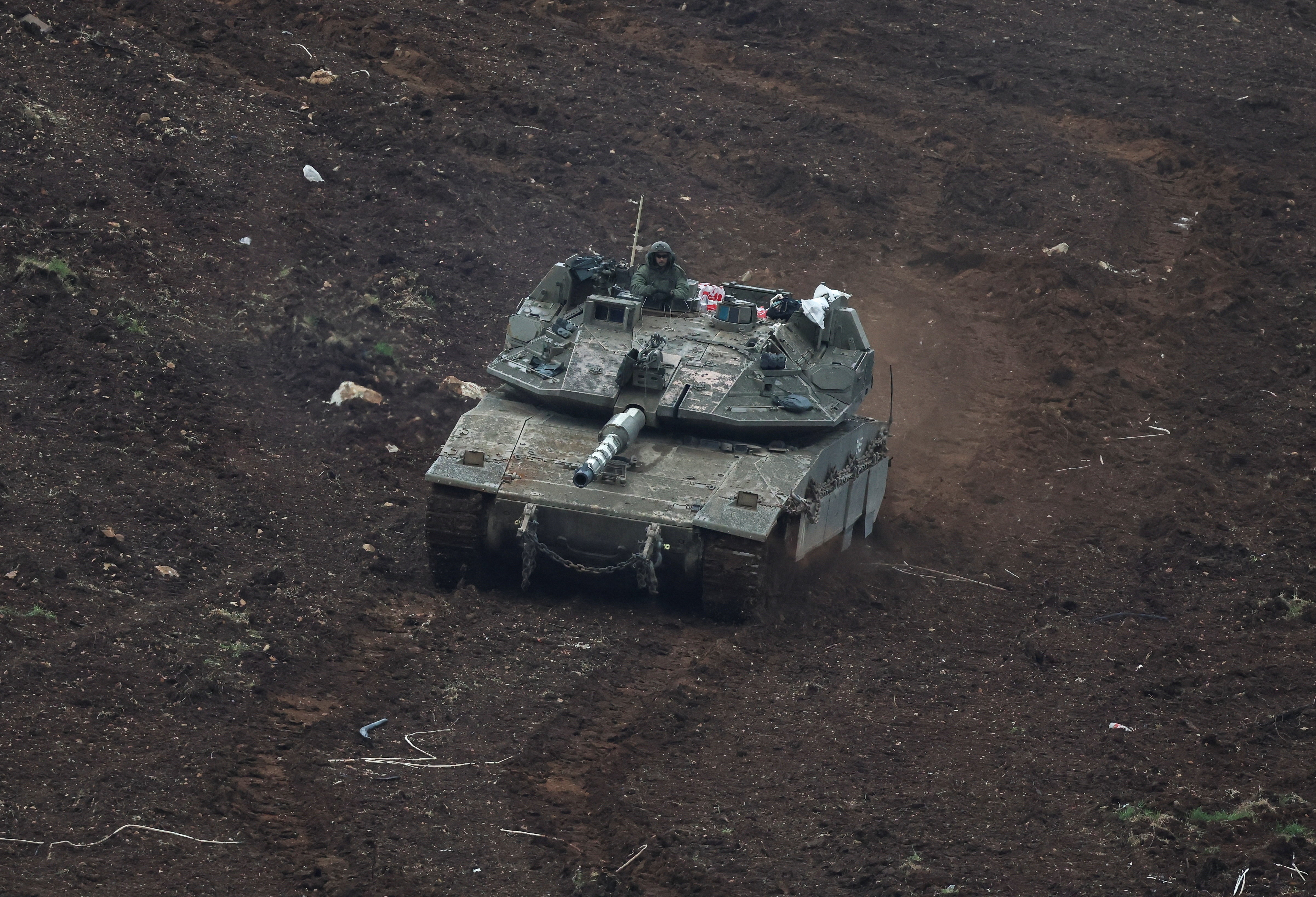 An Israeli tank manoeuvers on the Israeli side of the Israel-Lebanon border, amid escalation between Hezbollah and Israel, and amid the U.S.-Israeli conflict with Iran, in northern Israel