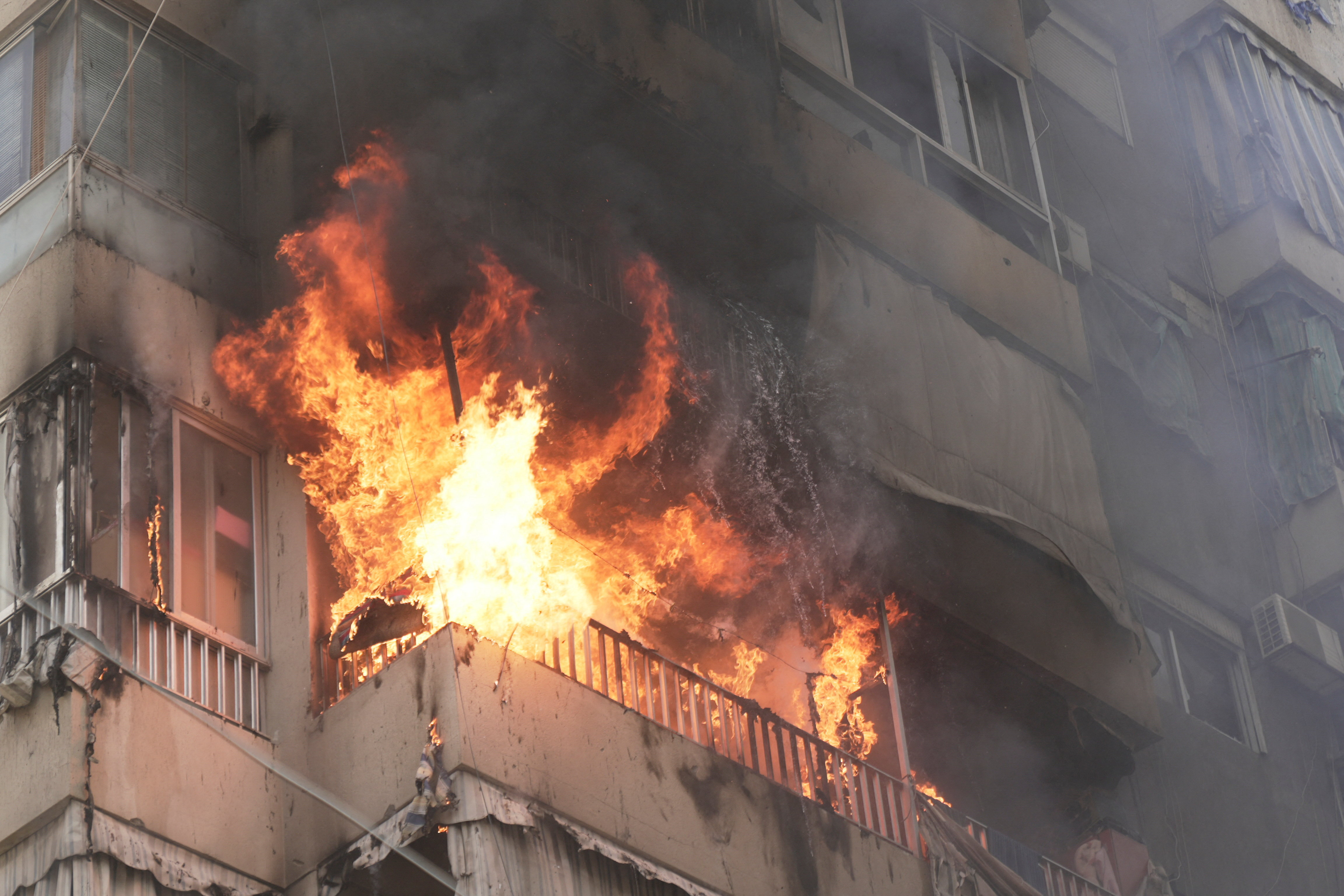 Flames engulf a building following an Israeli air strike in Beirut, following an escalation between Hezbollah and Israel amid the U.S.-Israeli conflict with Iran, in Lebanon, March 18, 2026.