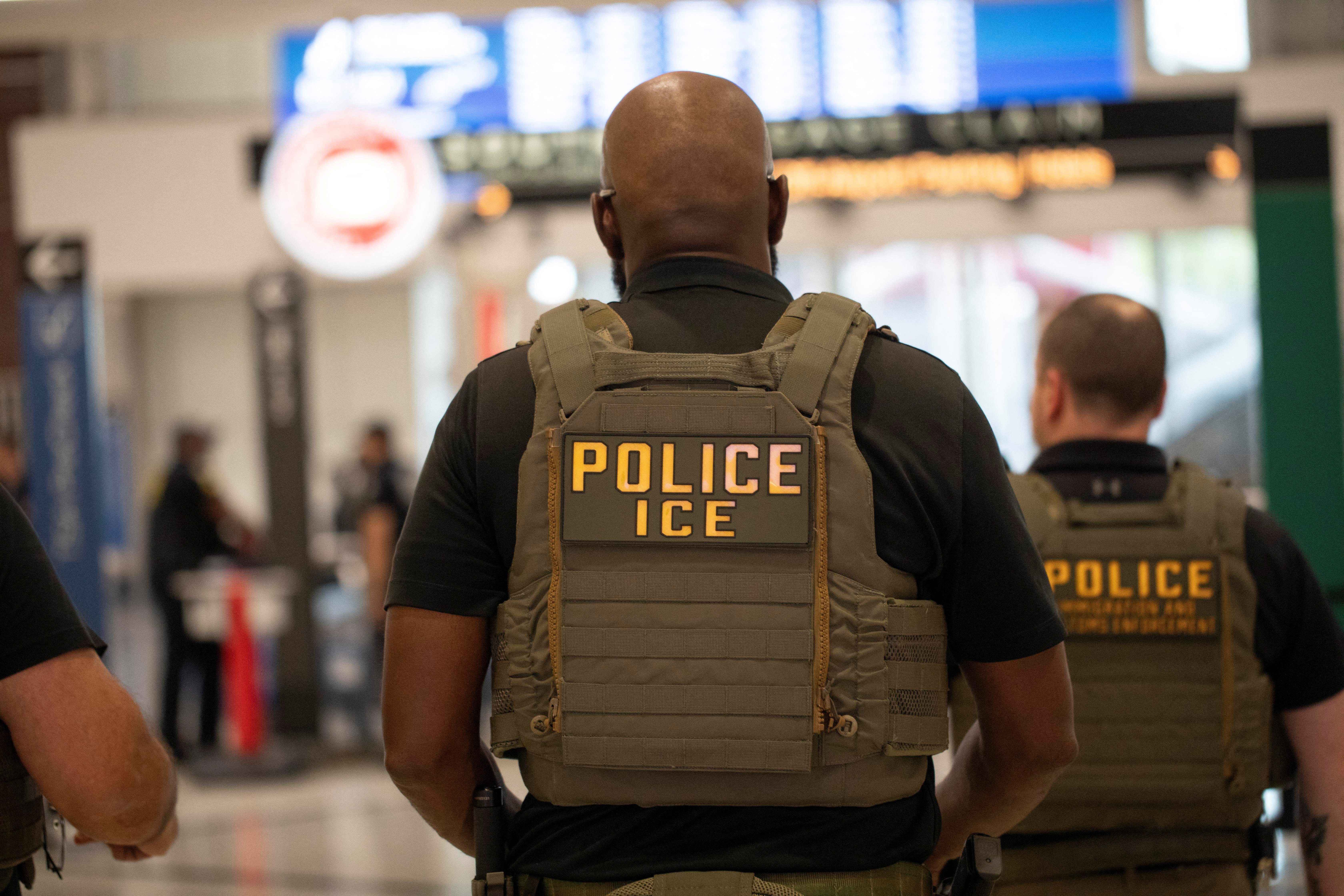 Immigration and Customs Enforcement (ICE) agents. REUTERS/Alyssa Pointer