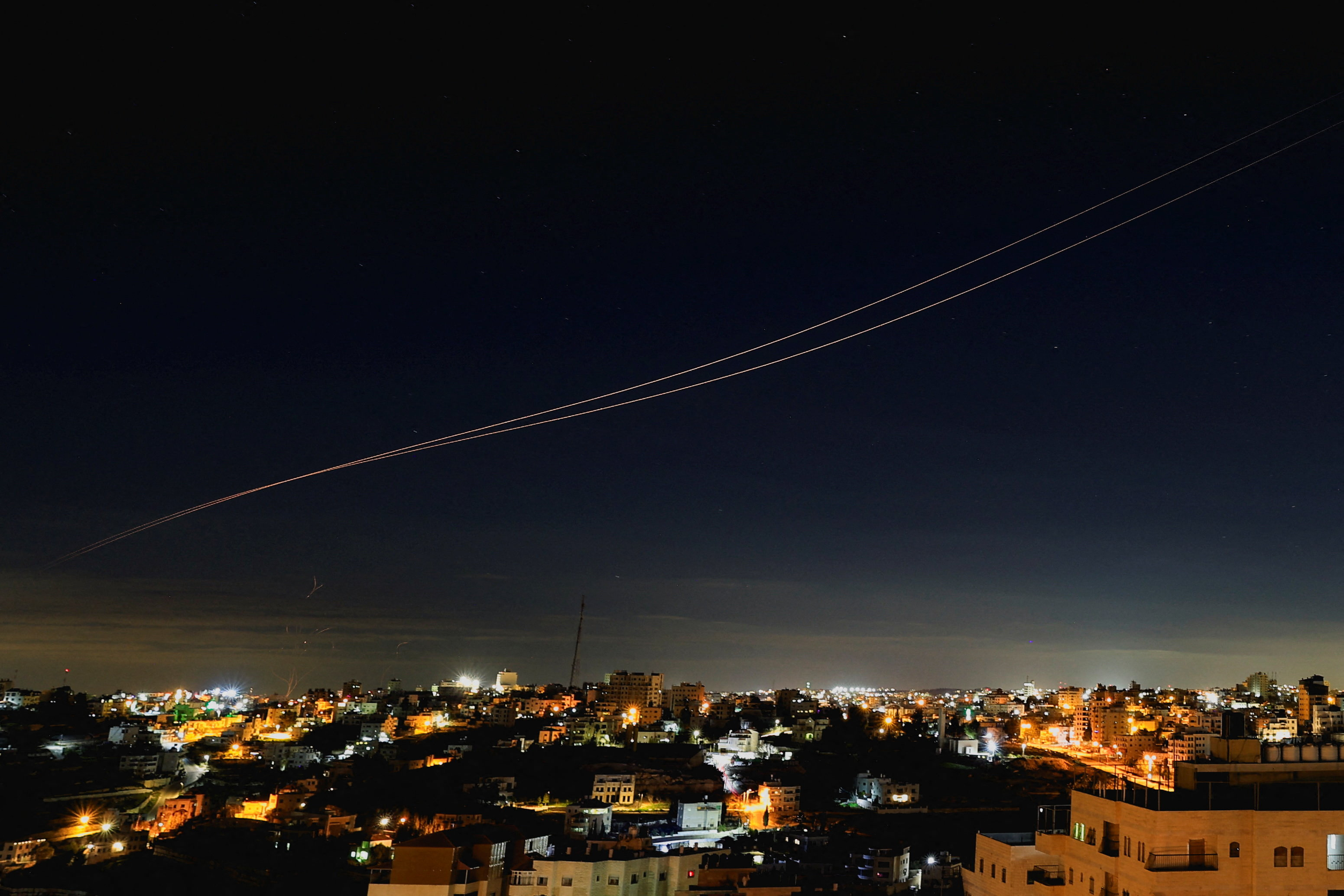 Iranian missiles fly towards Israel, amid the U.S.-Israeli conflict with Iran, as seen from Hebron, in the Israeli-occupied West Bank, March 9, 2026.