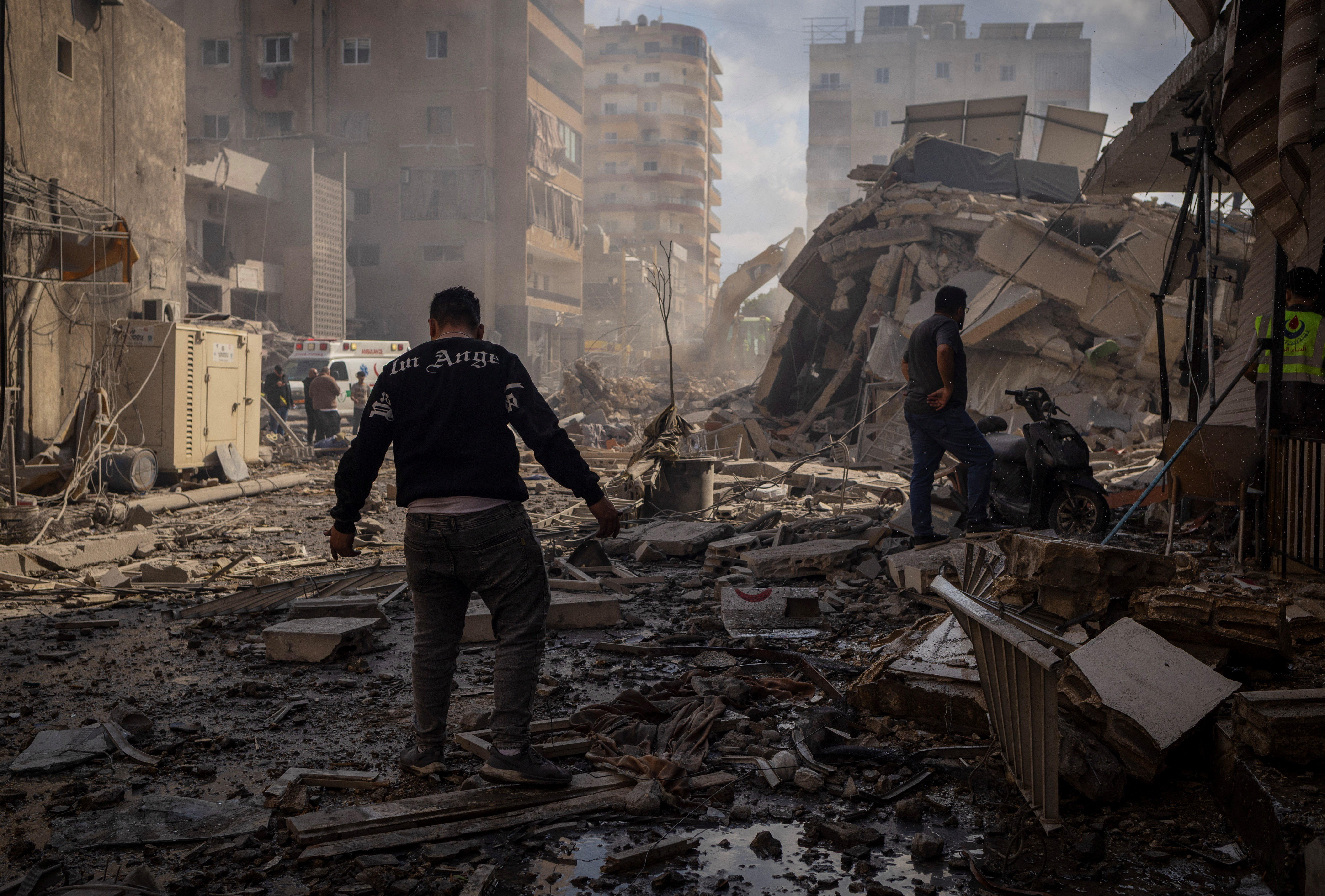 A man walks past the rubble a building at the site of an Israeli strike in Tyre, Lebanon, April 8, 2026. REUTERS/Adnan Abidi