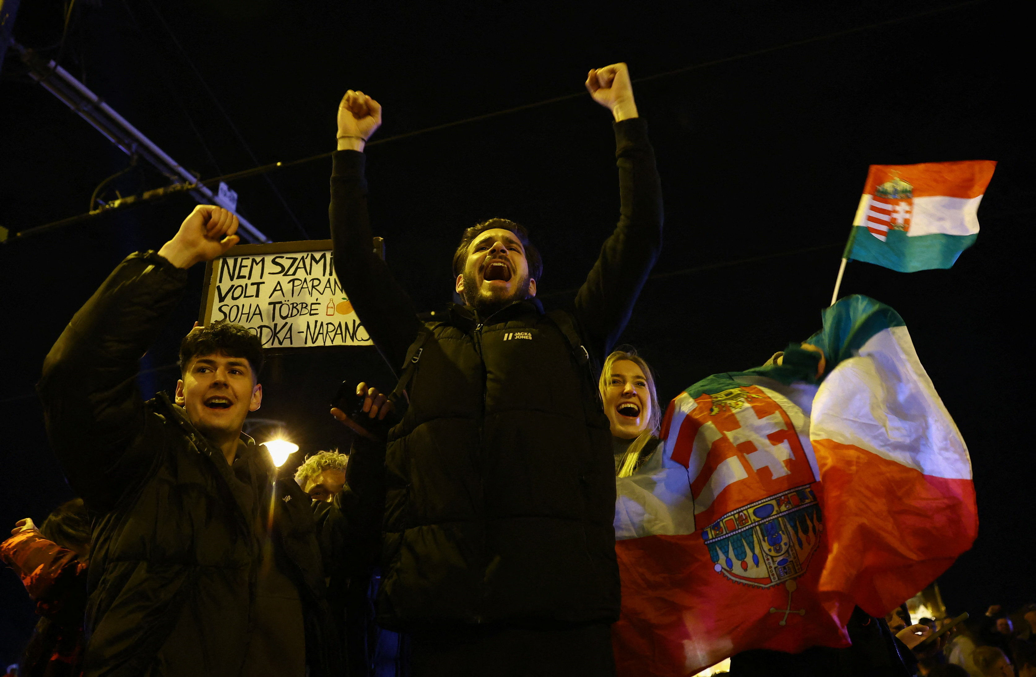 People celebrate following partial results on the day of the Hungarian Parliamentary election in Budapest, Hungary, April 13, 2026. REUTERS/Bernadett Szabo
