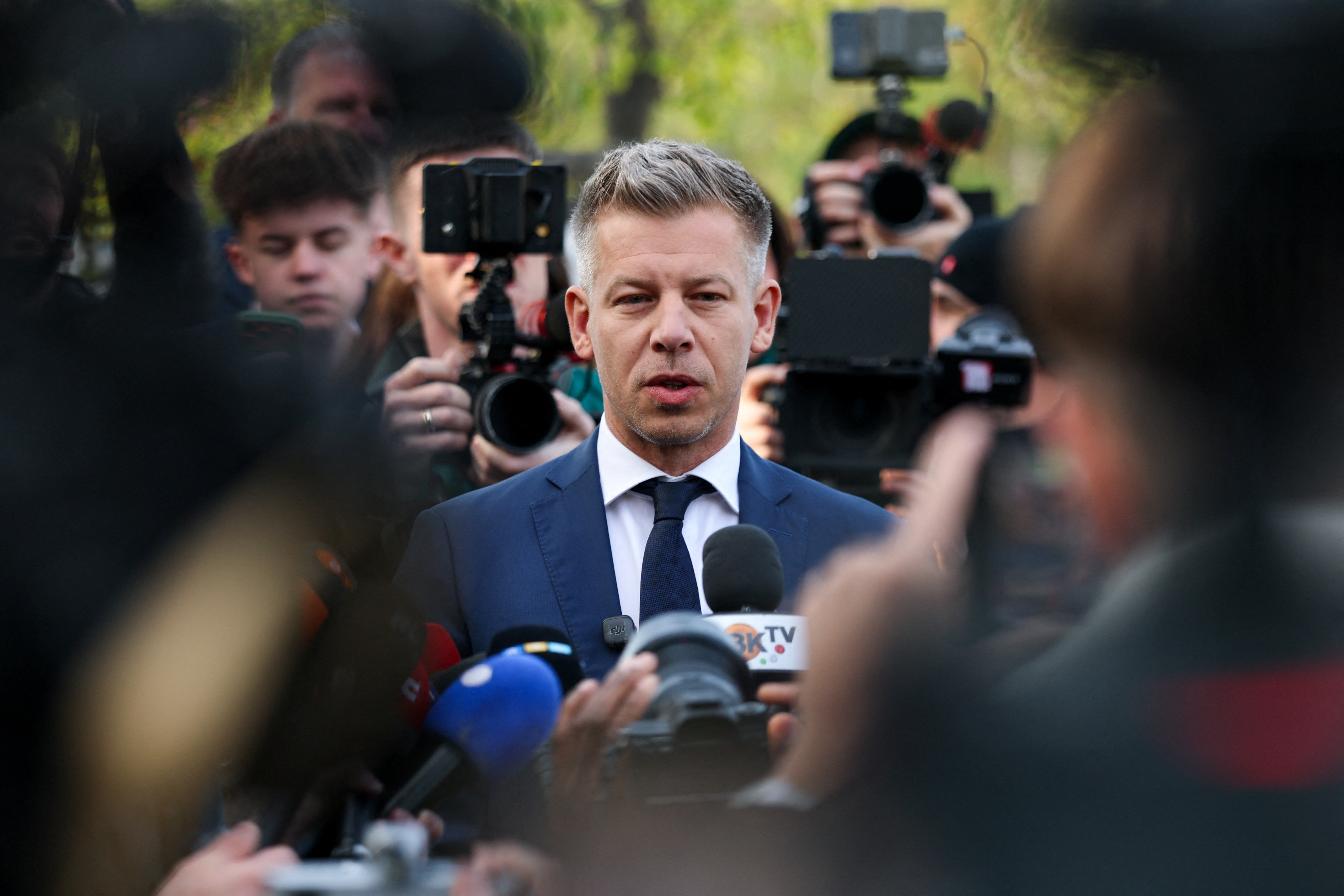 Peter Magyar, leader of the opposition Tisza party, speaks to the media after voting during the Hungarian parliamentary election in Budapest, Hungary, April 12, 2026. REUTERS/Leonhard Foeger