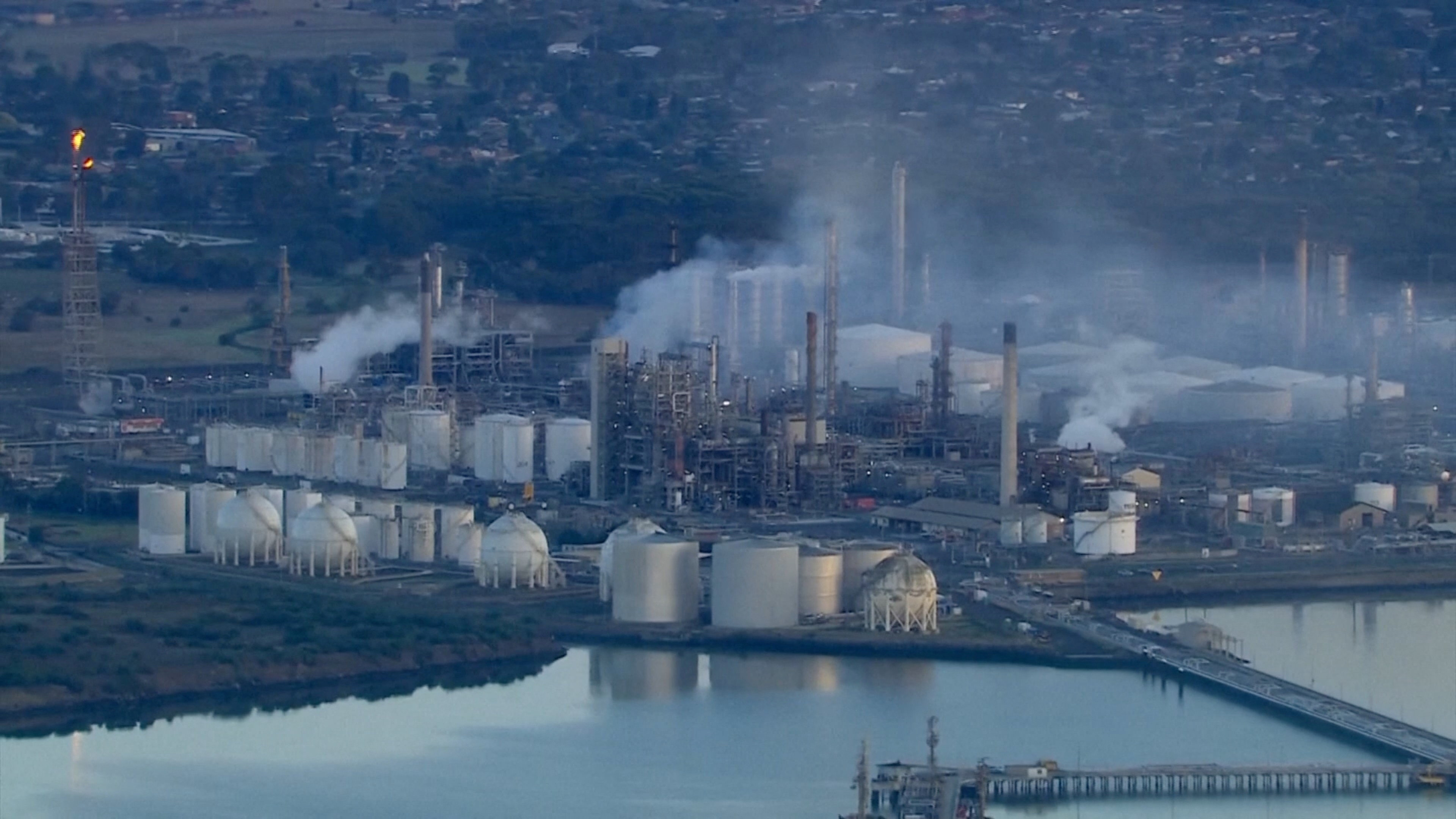 An aerial view shows smoke rising following a fire at Viva Energy Group's refinery in Geelong, Australia