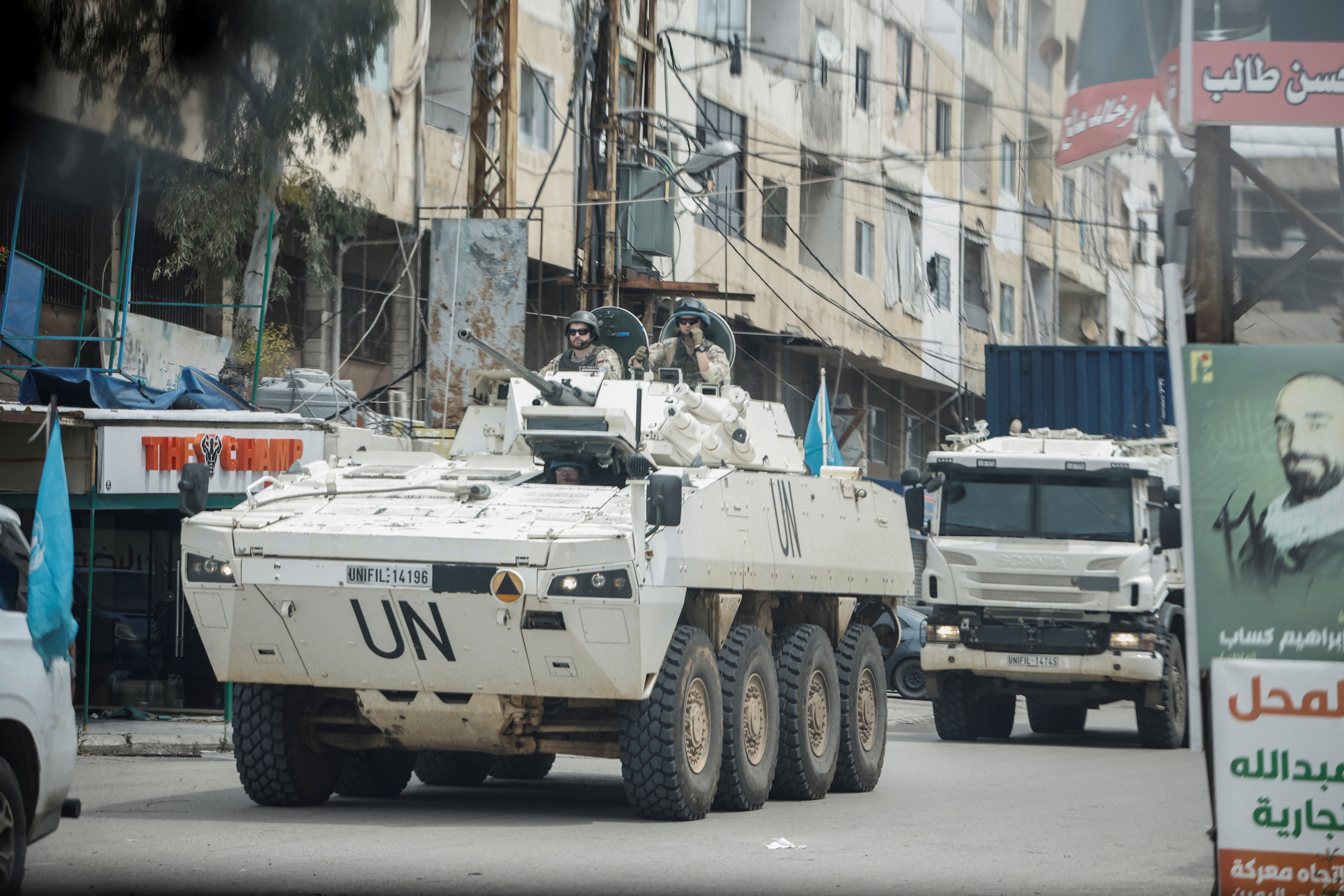 A UNIFIL convoy rides through the town, as seen through the window of a vehicle, in Tyre, south Lebanon, April 15, 2026.