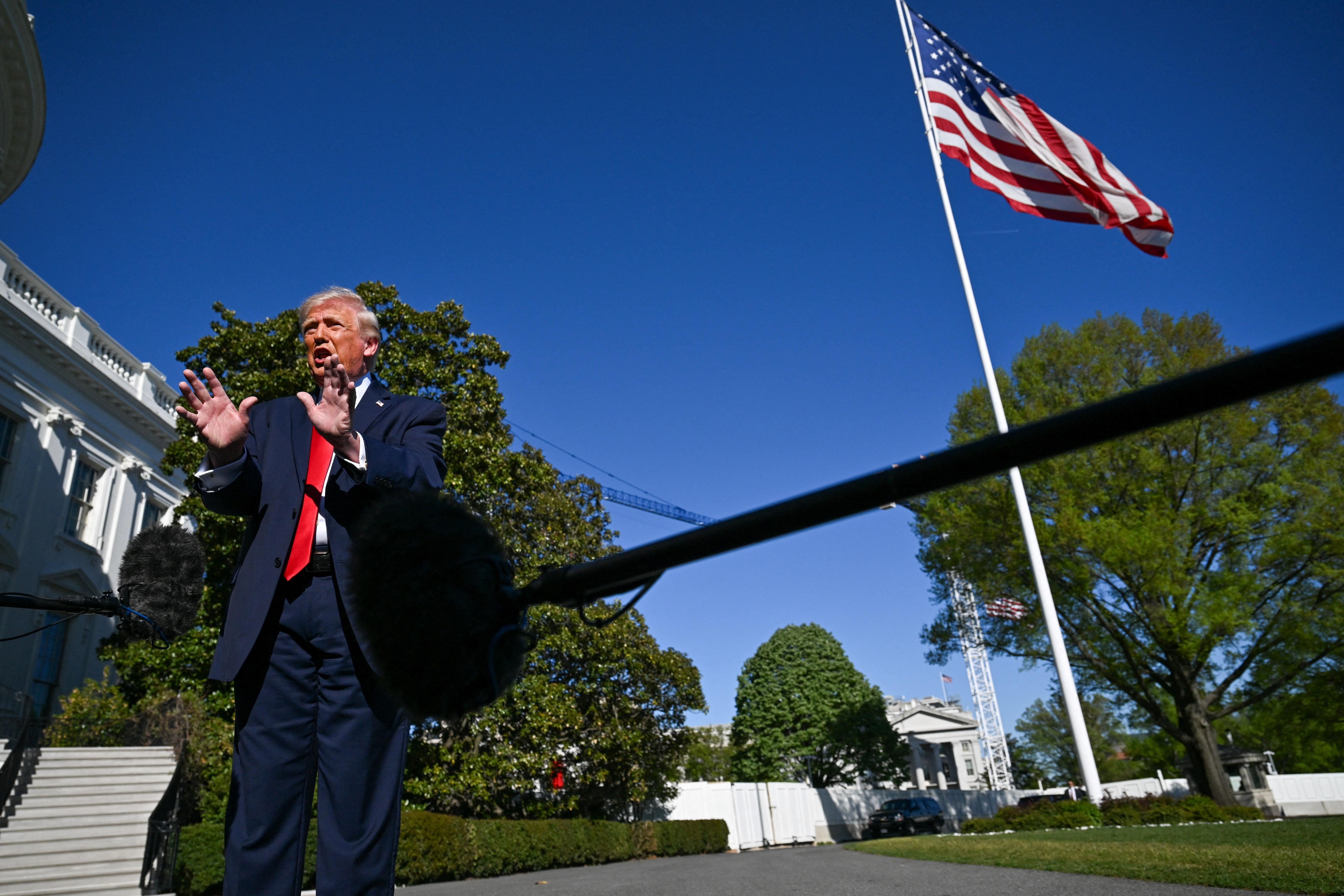 U.S. President Donald Trump speaks to the press, as he departs from the White House, en route to Joint Base Andrews (JBA), in Washington, D.C., U.S., April 11, 2026. REUTERS/Annabelle Gordon