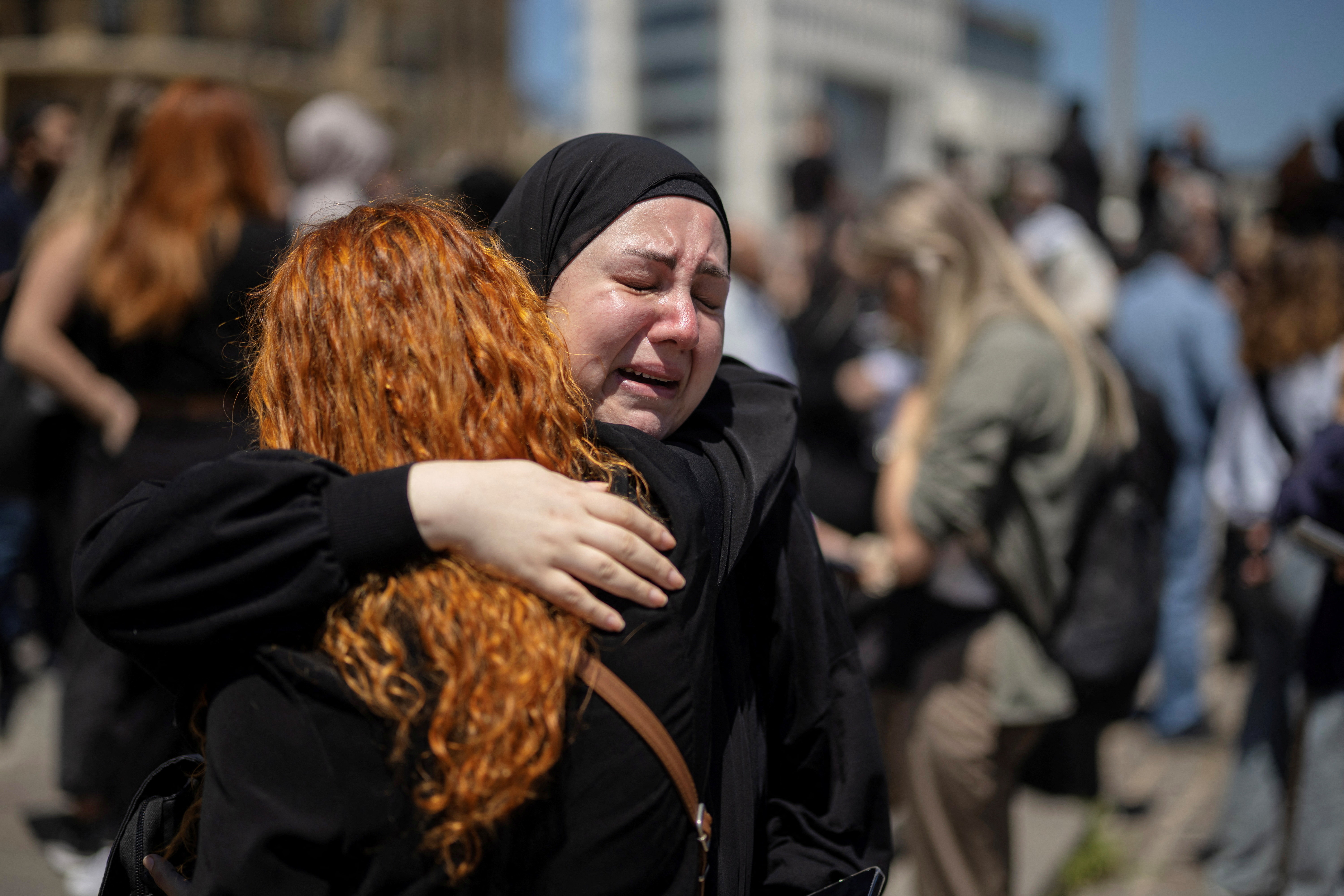 Protesters, including members of the media, attend a vigil to condemn the killing of journalists, a day after journalist Amal Khalil was killed in an Israeli strike, in Martyrs' Square, Beirut, Lebanon