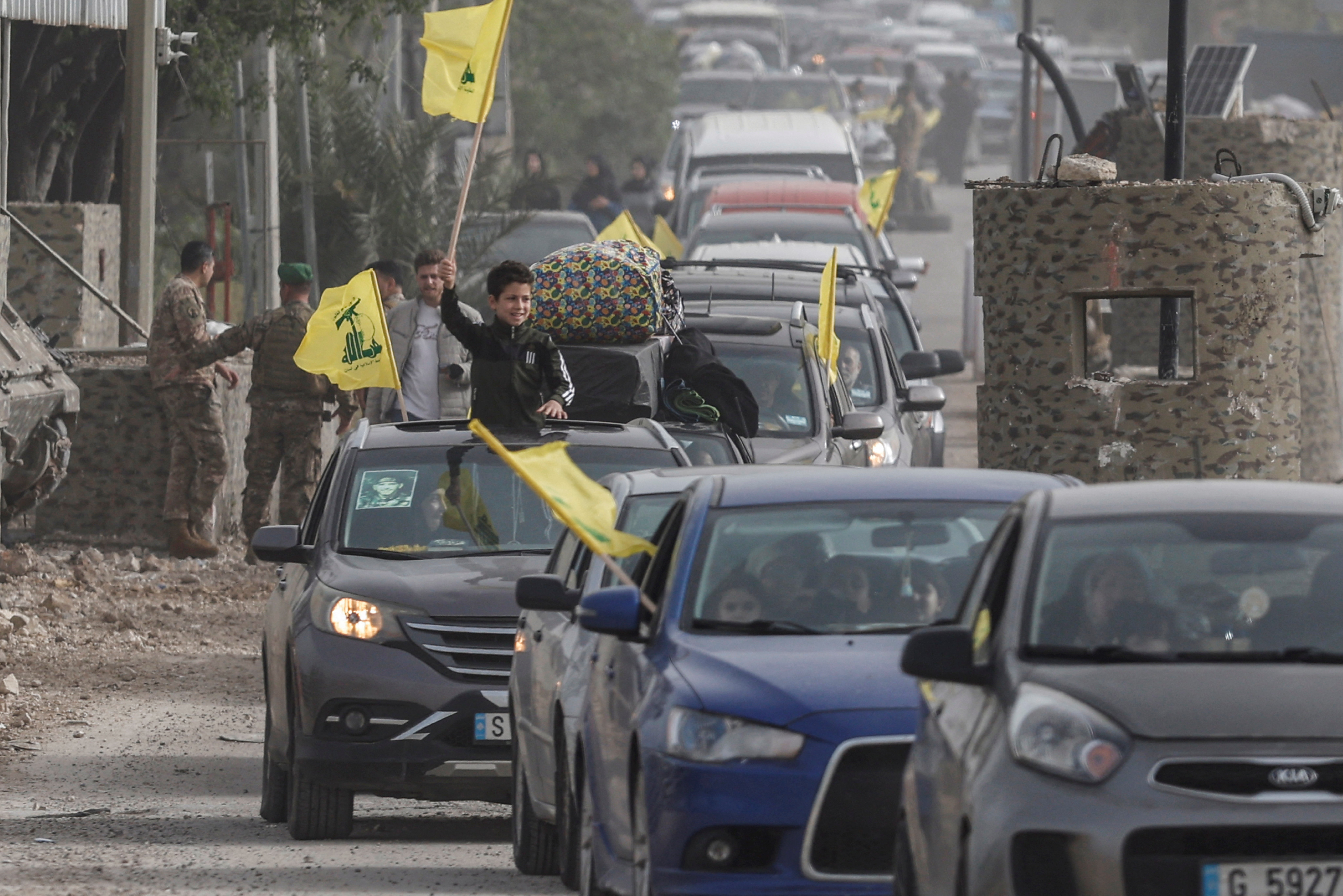 Displaced people make their way back to their homes after crossing the bridge linking southern Lebanon to the rest of the country, following  the ceasefire between Lebanon and Israel in Qasmiyeh, Lebanon, April 18, 2026.