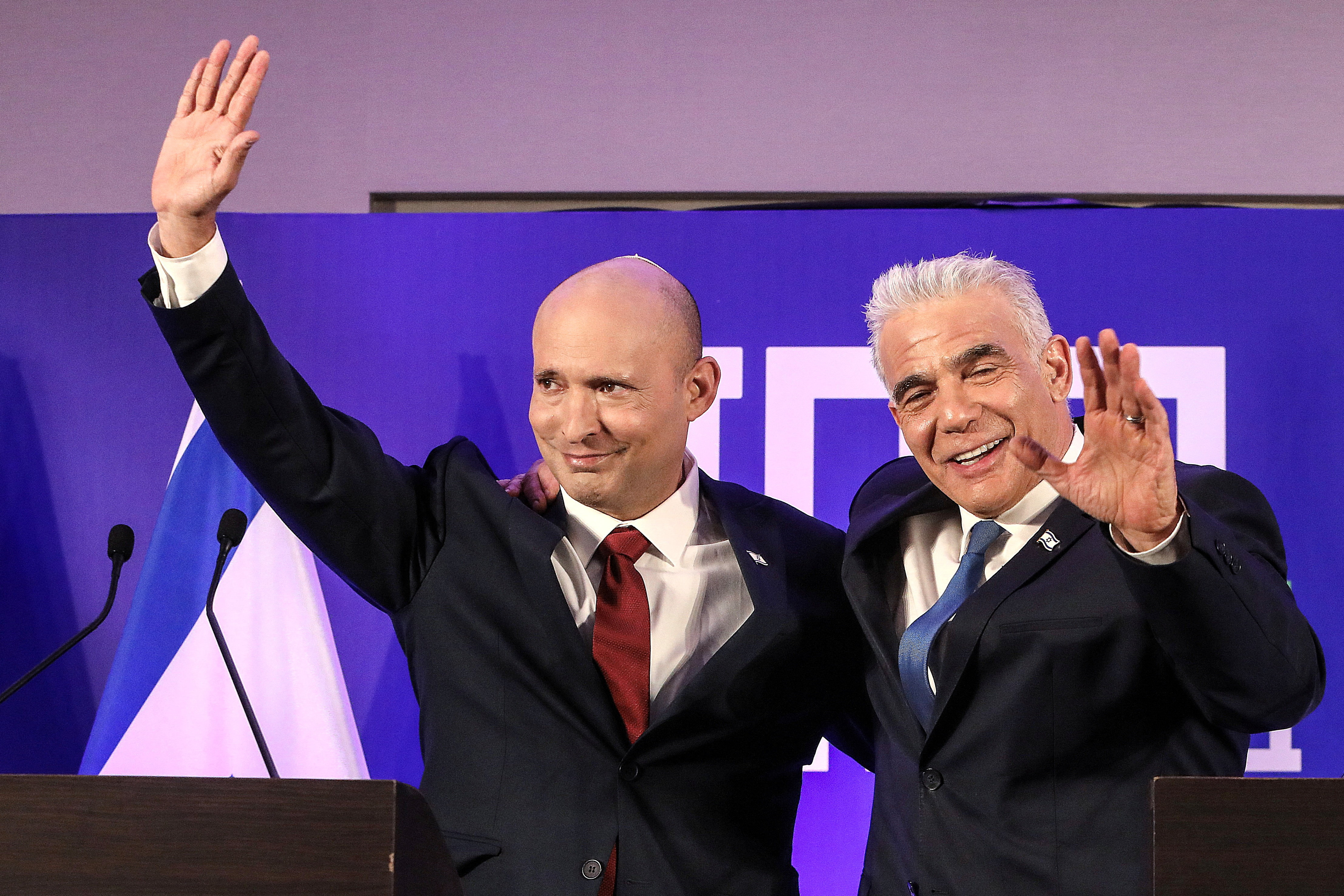 Former Israeli Prime minister Naftali Bennett and Israeli opposition leader Yair Lapid gesture as they announce their political union ahead of this year's general election, the new party will be called Together, in Herzliya, Israel April 26, 2026.