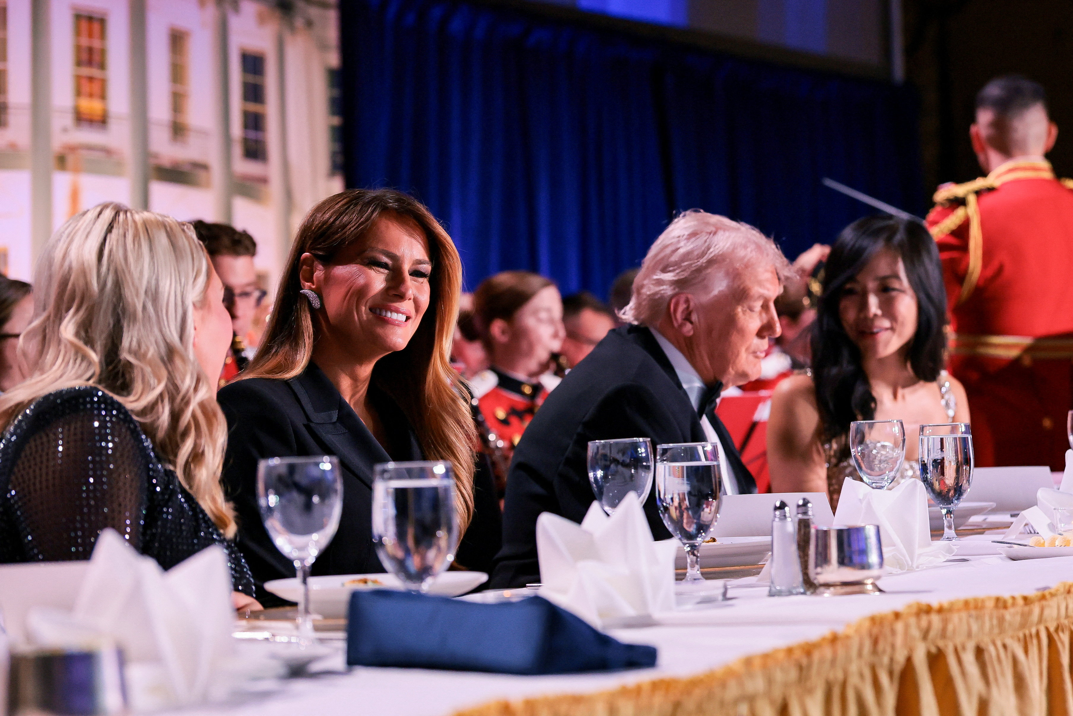 U.S. President Donald Trump, first lady Melania Trump, White House Press Secretary Karoline Leavitt and CBS News senior White House correspondent Weijia Jiang attend the annual White House Correspondents' Association dinner in Washington
