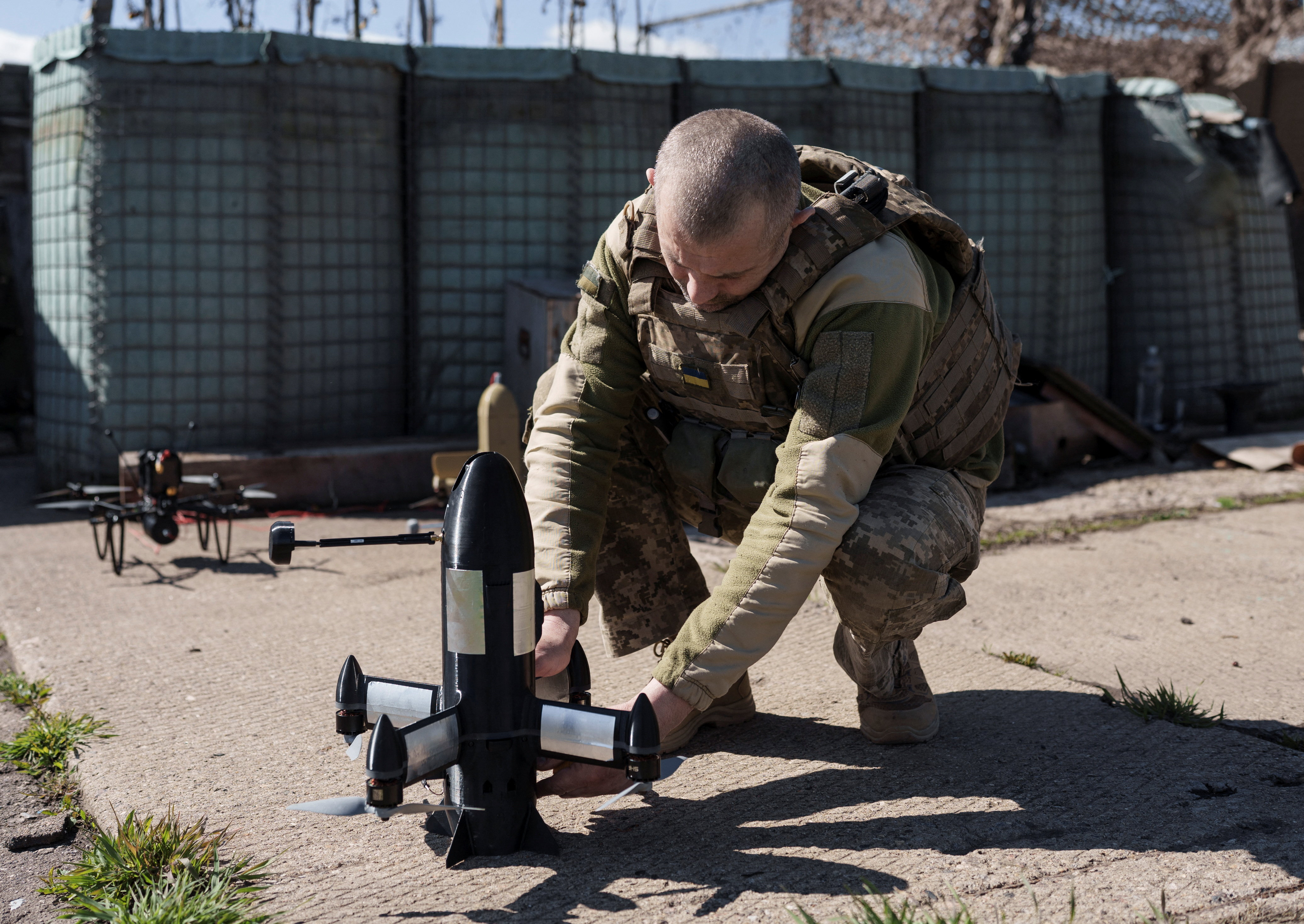 A serviceman of air defence unit of the 24th Separate Mechanized Brigade of the Ukrainian Armed Forces prepares a P1-Sun FPV interceptor drone for a launch near the frontline, amid Russia's attack on Ukraine, in Donetsk region, Ukraine