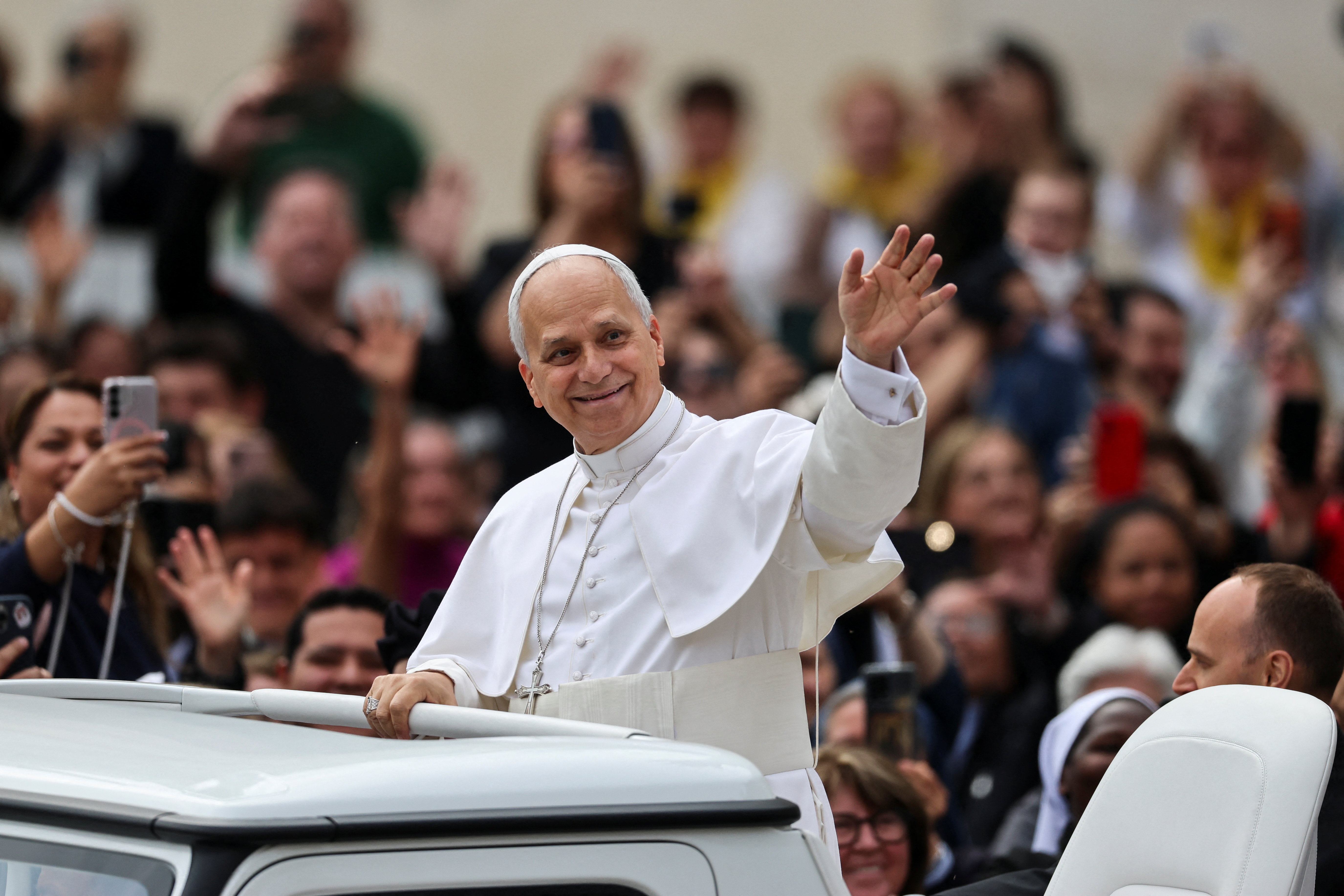 Pope Leo XIV waves as he arrives for the weekly general audience in St. Peter's Square at the Vatican, May 6, 2026. REUTERS/Yara Nardi
