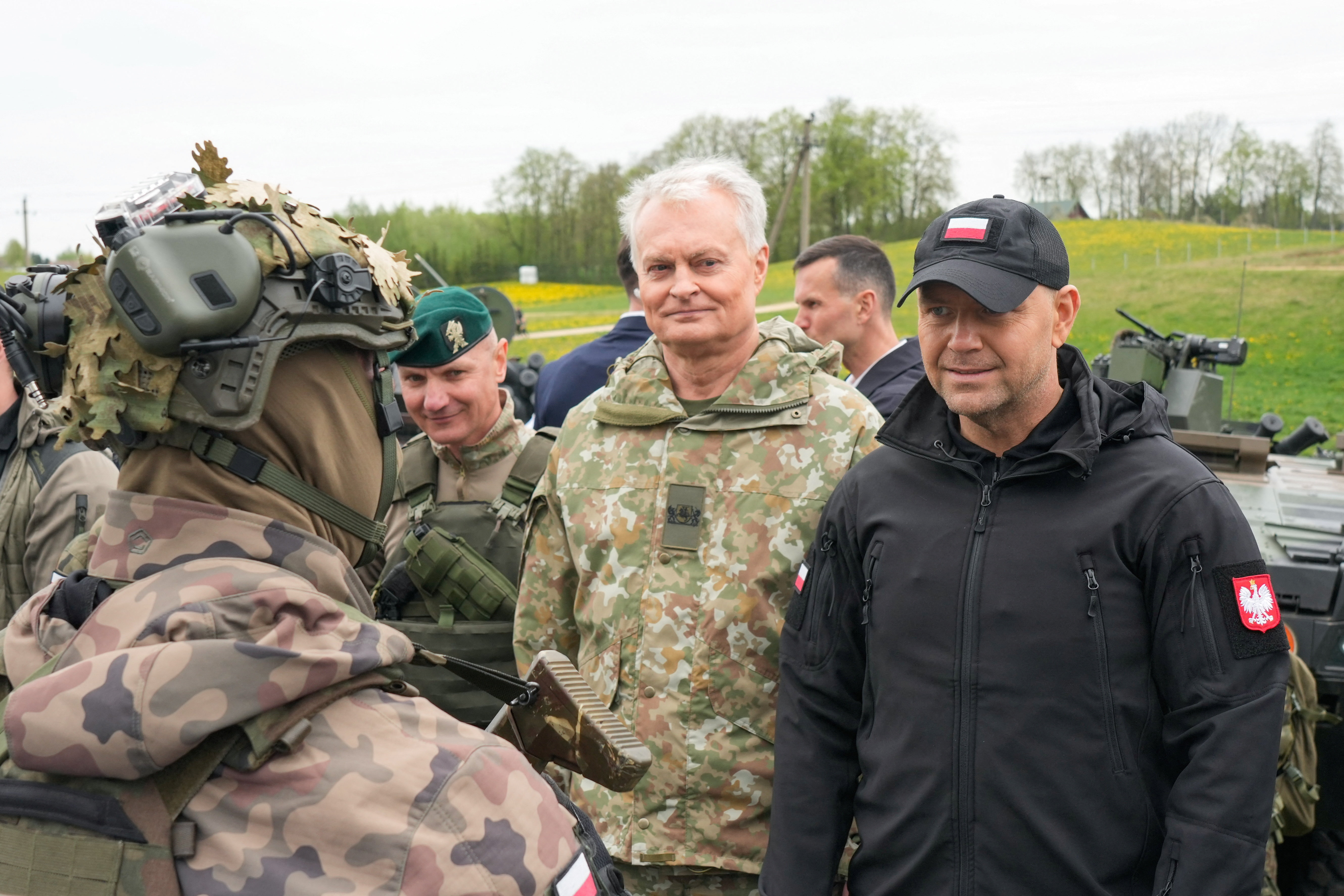 Polish President Karol Nawrocki and Lithuanian President Gitanas Nauseda speak with soldiers during the day of the "Brave Griffin 26/II" military exercise near the strategically crucial Suwalki gap in Akmenynai, Lithuania May 6, 2026.