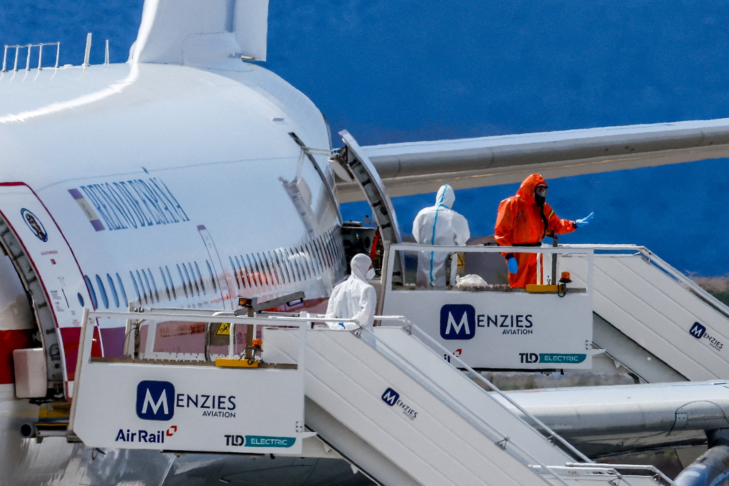 Passengers of the cruise ship MV Hondius, which was affected by a hantavirus outbreak, board a Spanish plane at Tenerife Sud airport, Canary Islands, Spain, May 10, 2026. REUTERS/Borja Suarez
