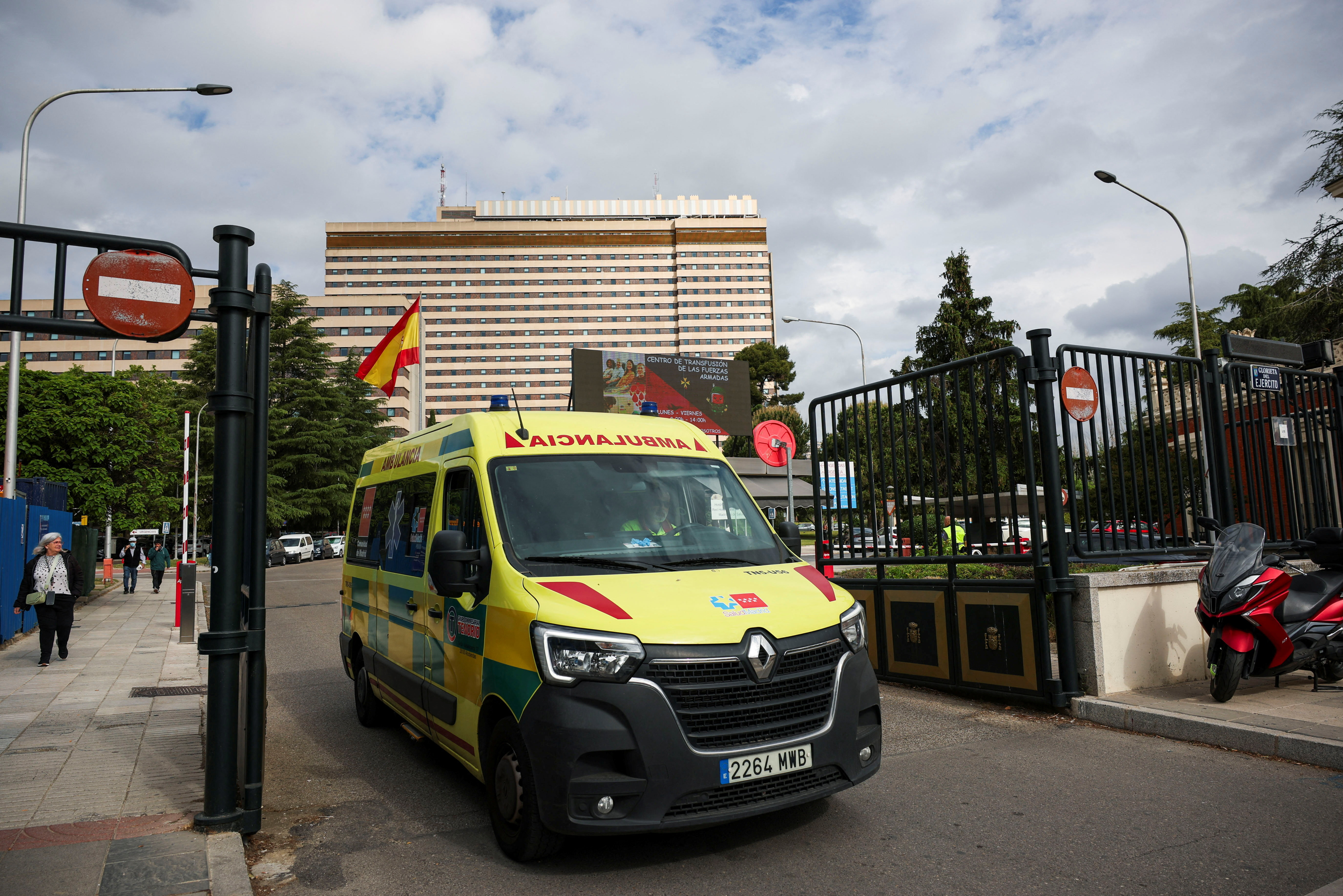 An ambulance drives out of the Gomez Ulla Military Hospital. REUTERS/Isabel Infantes