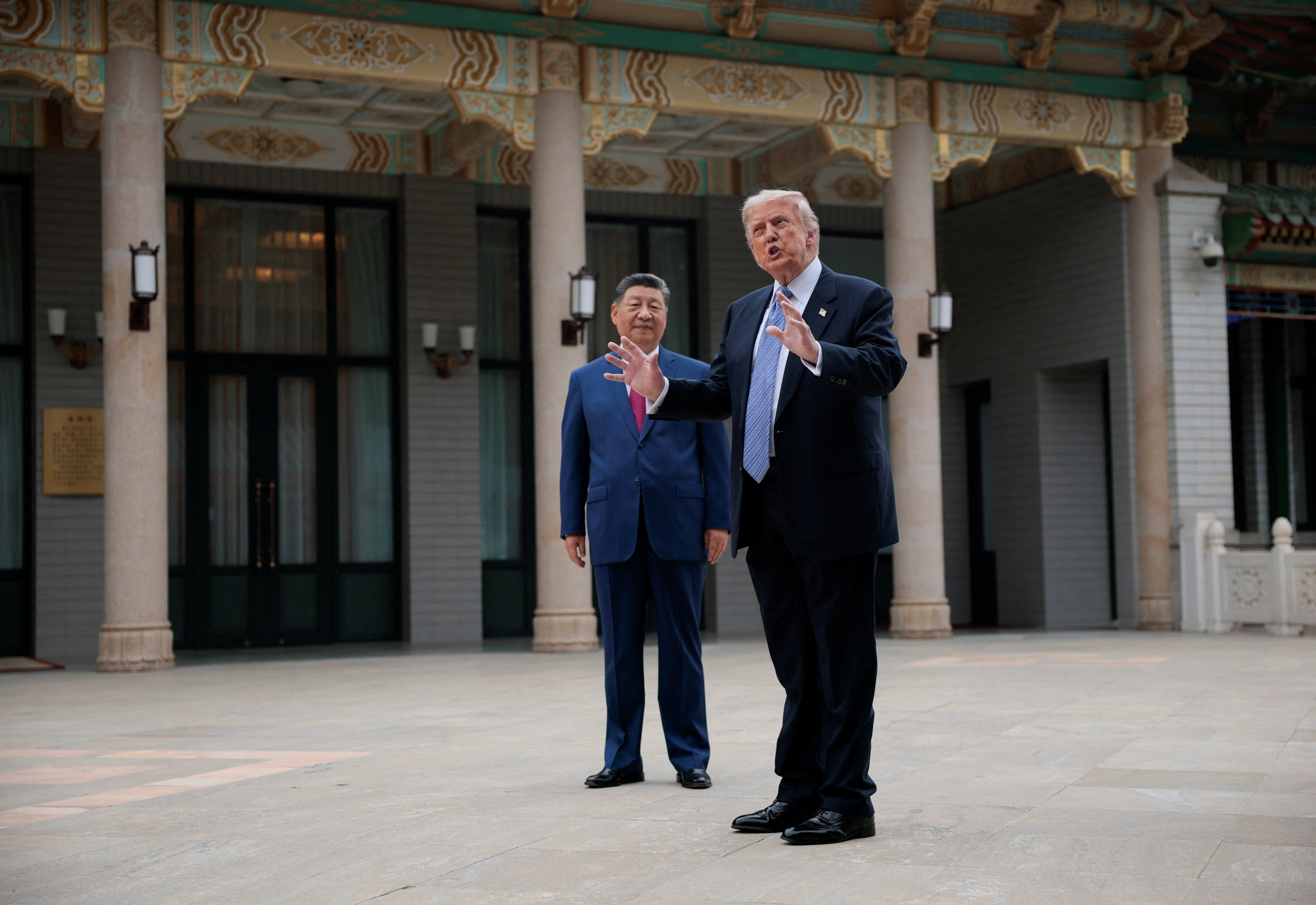 U.S. President Donald Trump gestures as he speaks next to Chinese President Xi Jinping during a visit to the  Zhongnanhai Garden in Beijing, China, May 15, 2026. REUTERS/Evan Vucci/Pool