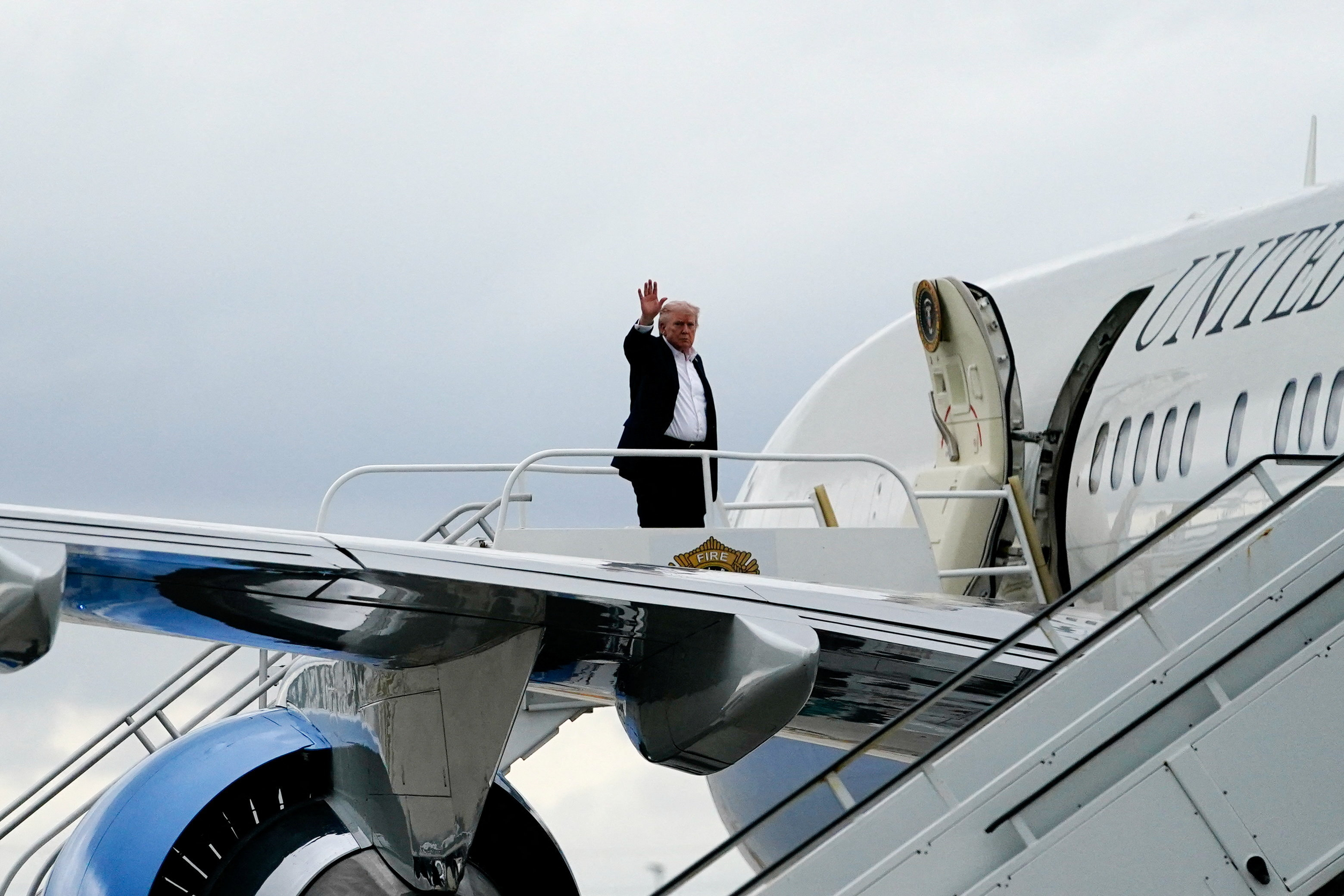 U.S. President Donald Trump boards Air Force One en route to Washington, D.C., while departing from Miami International Airport in Florida, U.S., May 3, 2026.