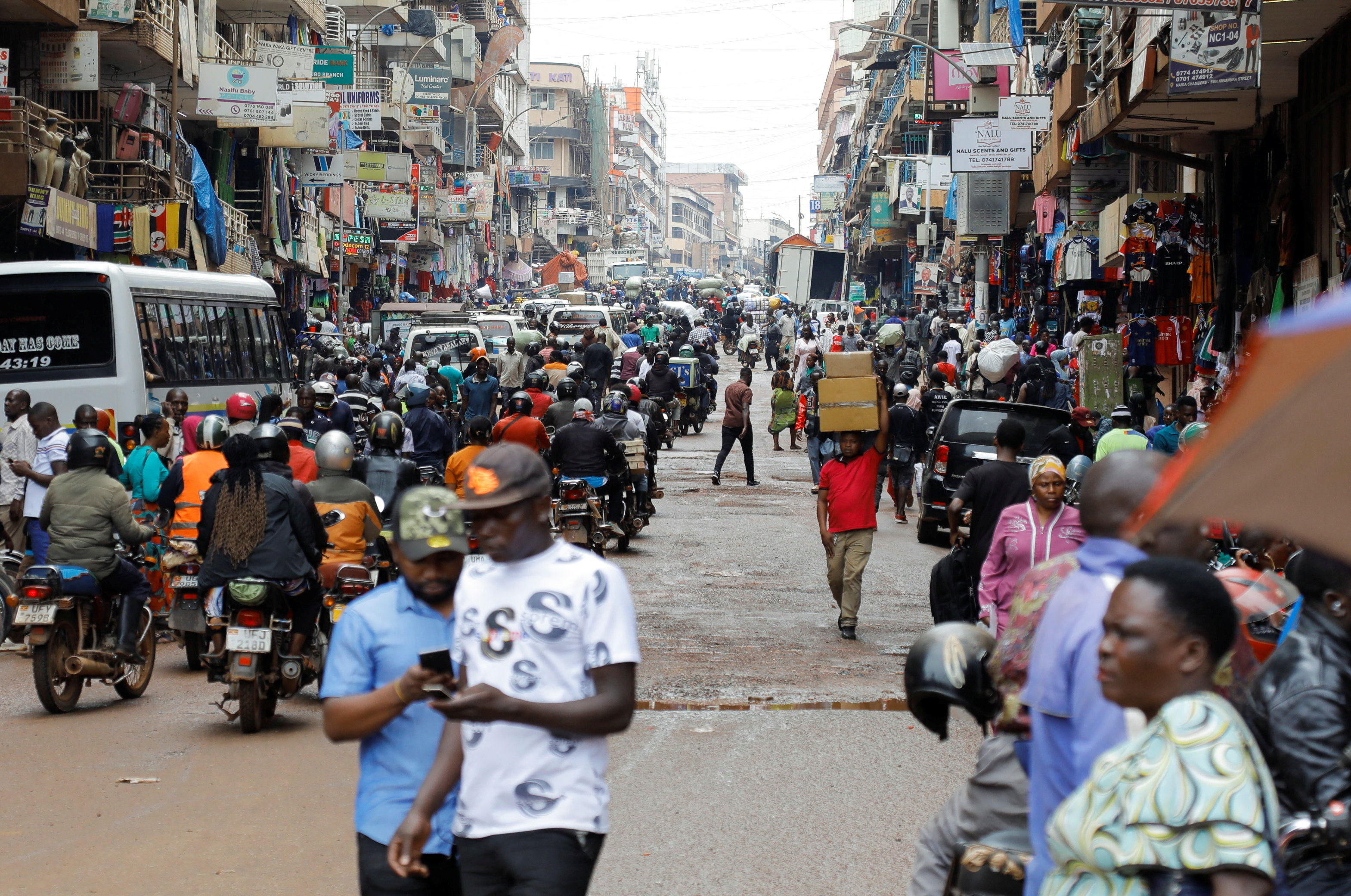 Motorcycle taxis carry passengers following a resurgence of Ebola involving the Bundibugyo strain, a rare variant of the virus with no approved vaccine currently available, along Ben Kiwanuka street in Kampala, Uganda May 21, 2026.