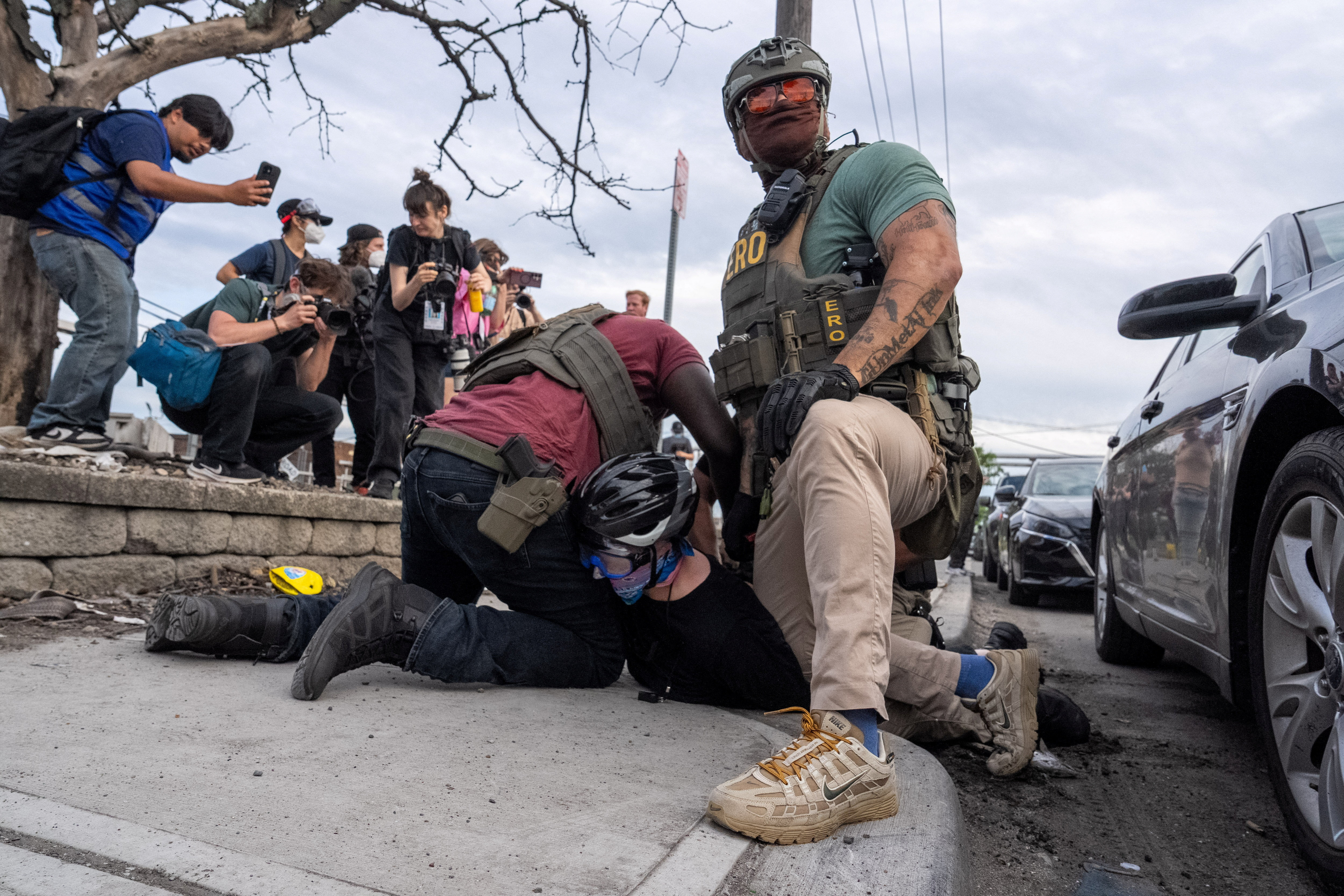 A protester is detained by ICE agents outside Delaney Hall in Newark, New Jersey, U.S., May 26, 2026.
