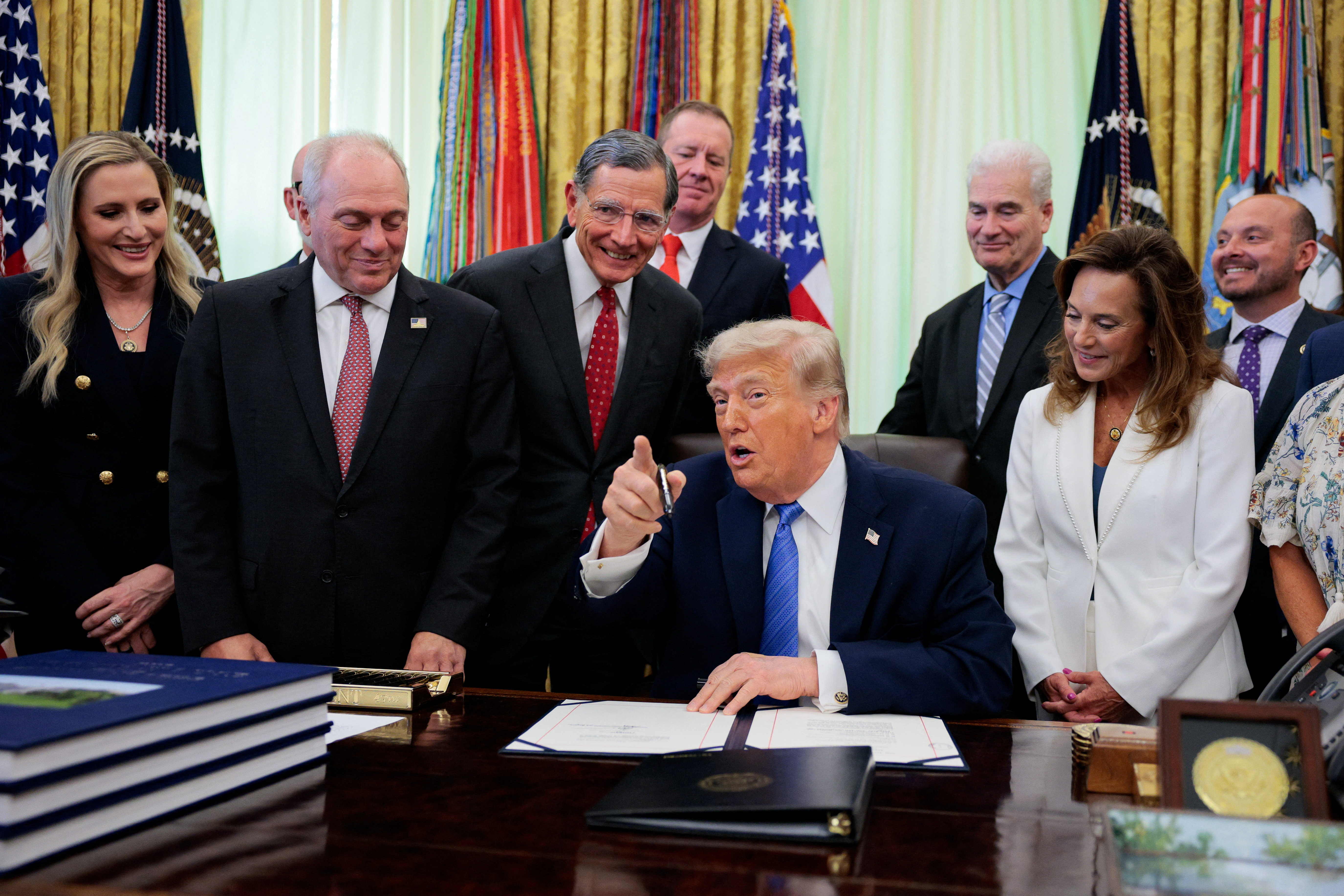 U.S. President Donald Trump speaks in the Oval Office as he signs the Secure America Act, at the White House in Washington, D.C., U.S., June 10, 2026.