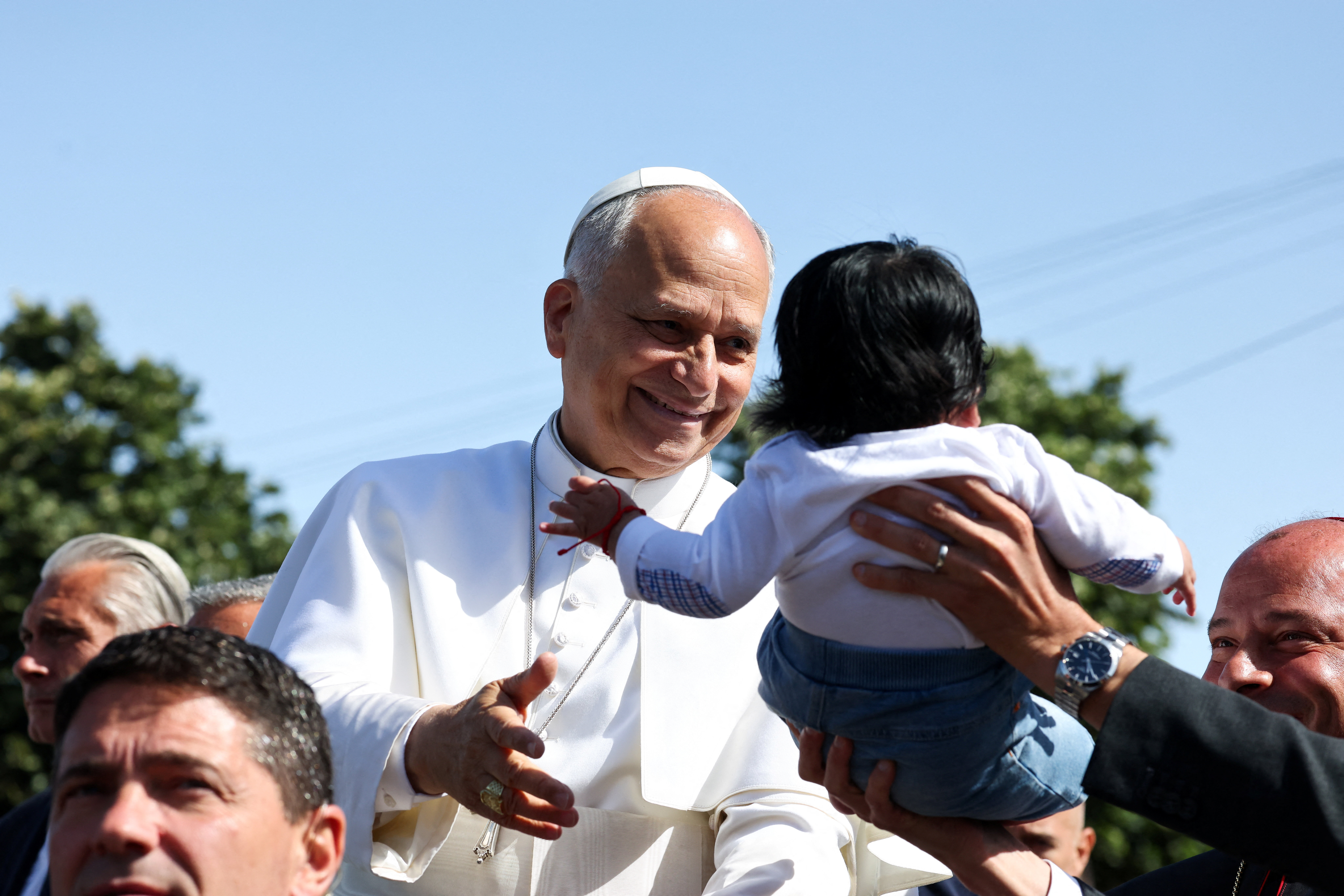 Pope Leo XIV smiles at a child at the Plaza del Cristo de La Laguna, Tenerife. REUTERS/Yara Nardi