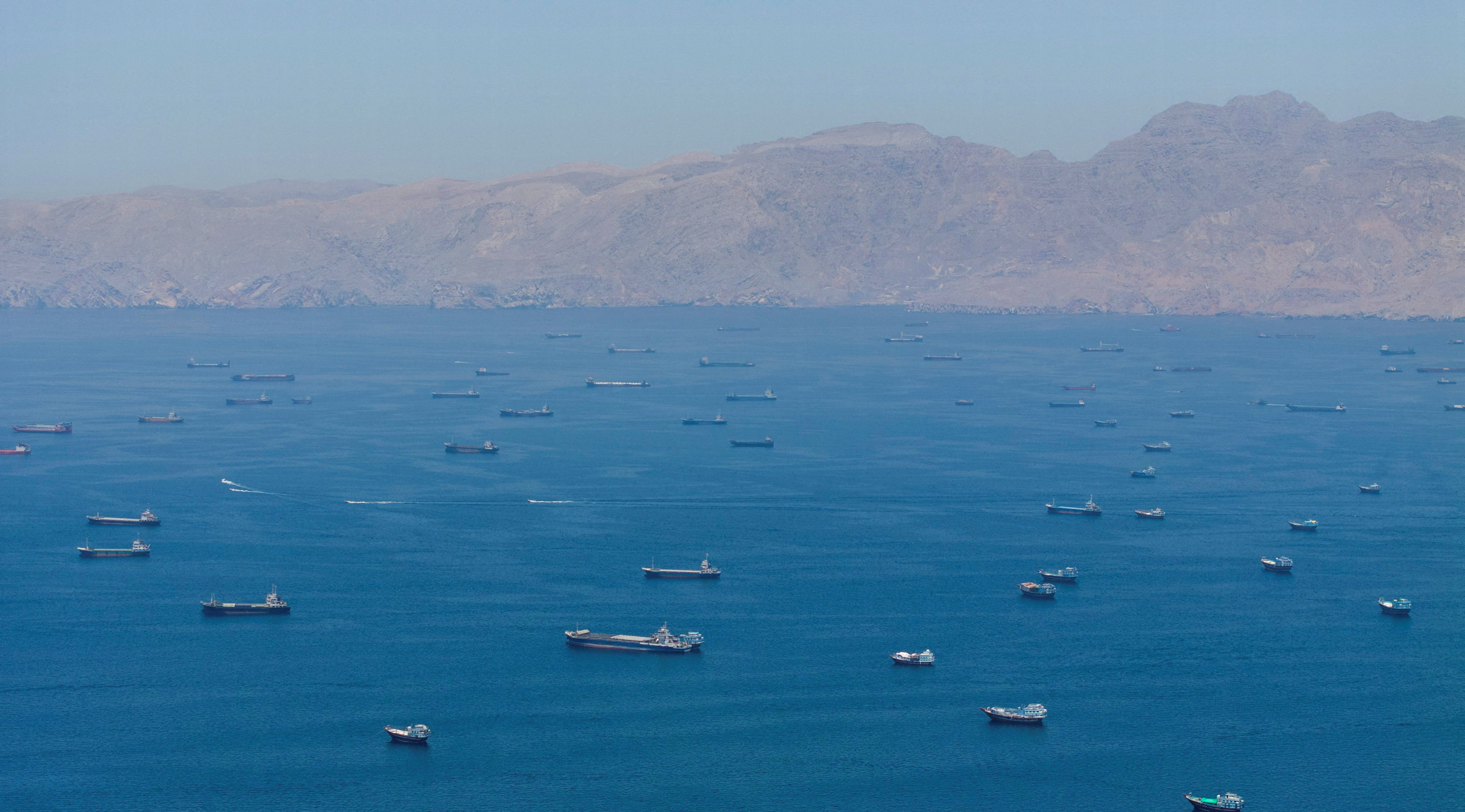 FILE PHOTO: A drone view shows vessels anchored at the Strait of Hormuz. REUTERS/Stringer/File Photo