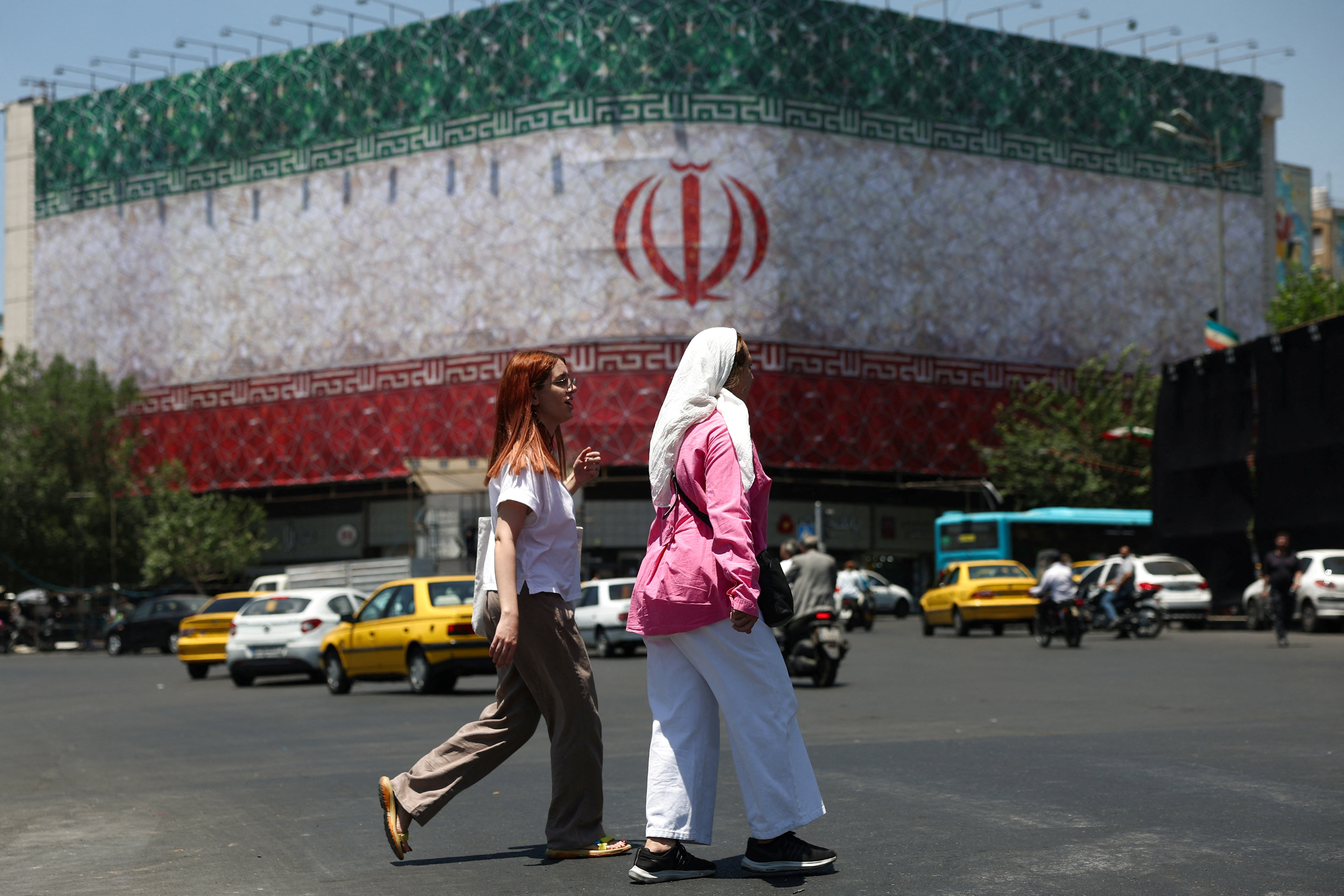 People walk on a street in Tehran, Iran, June 14, 2026.