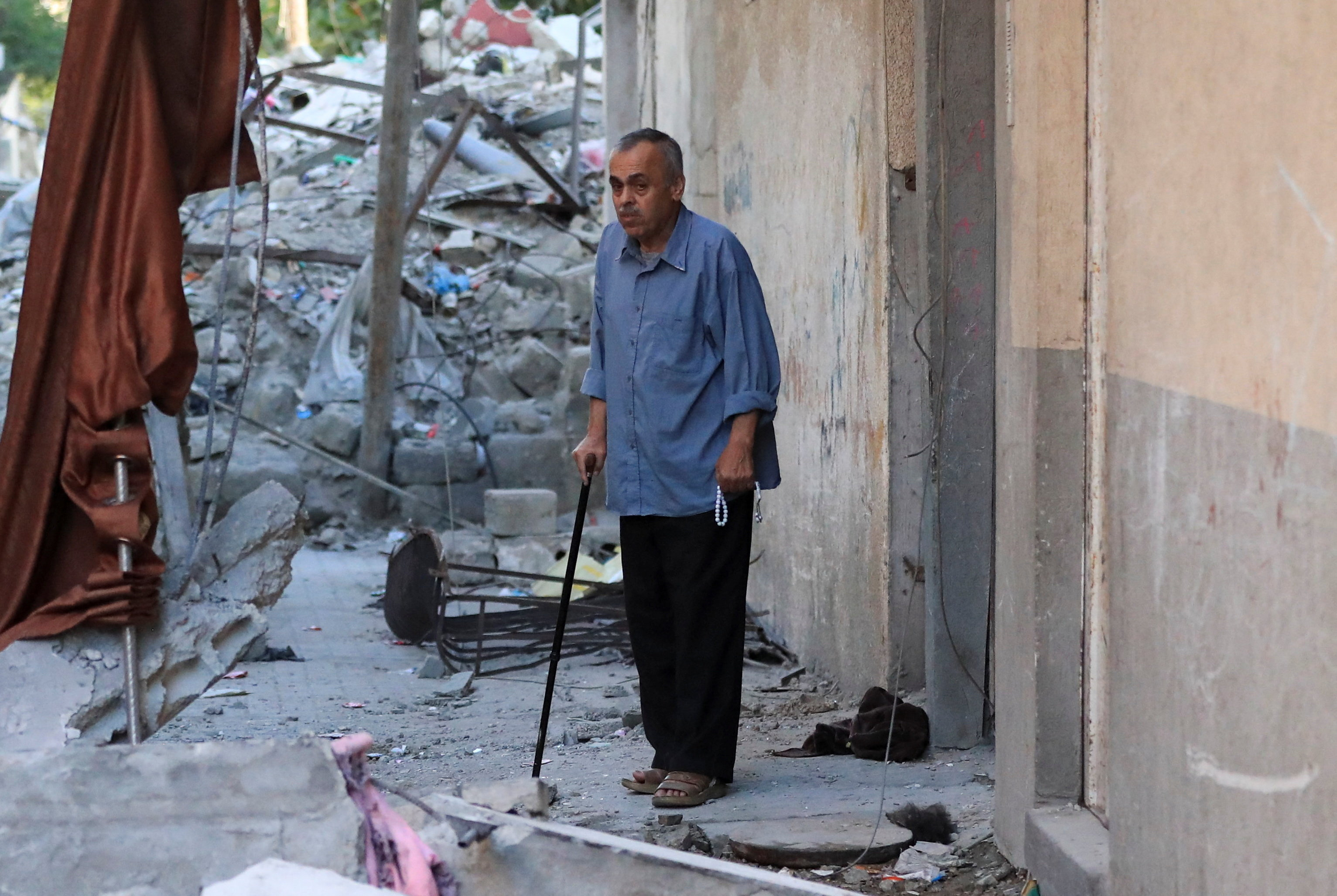 A Palestinian man inspects the site of an Israeli strike on an apartment in Gaza City, June 20, 2026. REUTERS/Dawoud Abu Alkas