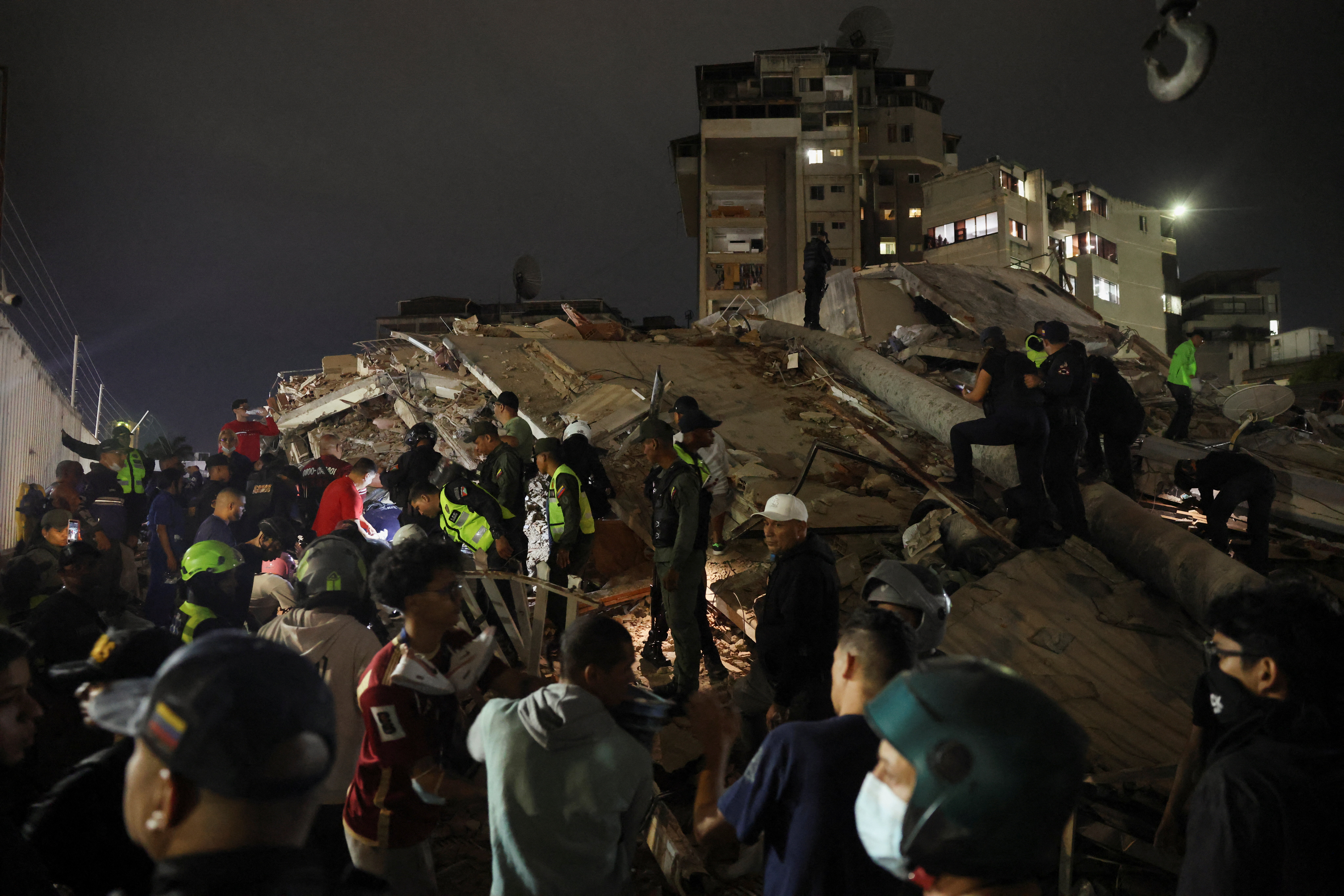 Emergency services work at the site of a collapsed building after an earthquake in Caracas, Venezuela, June 24, 2026. REUTERS/Leonardo Fernandez Viloria