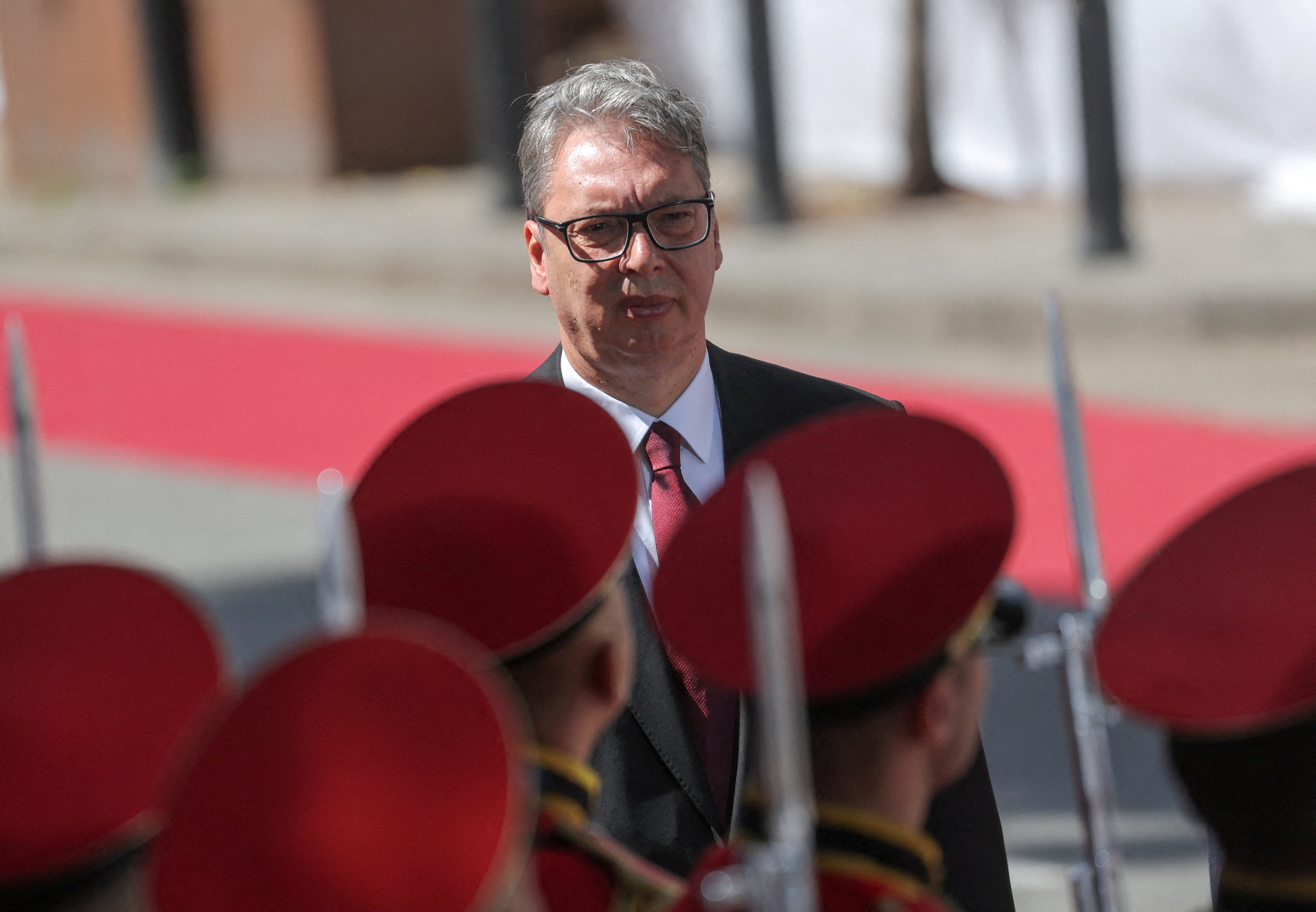 FILE PHOTO: Serbian President Aleksandar Vucic walks past guards of honour during a welcoming ceremony prior to a meeting with Georgian President Mikheil Kavelashvili in Tbilisi, Georgia, June 15, 2026.