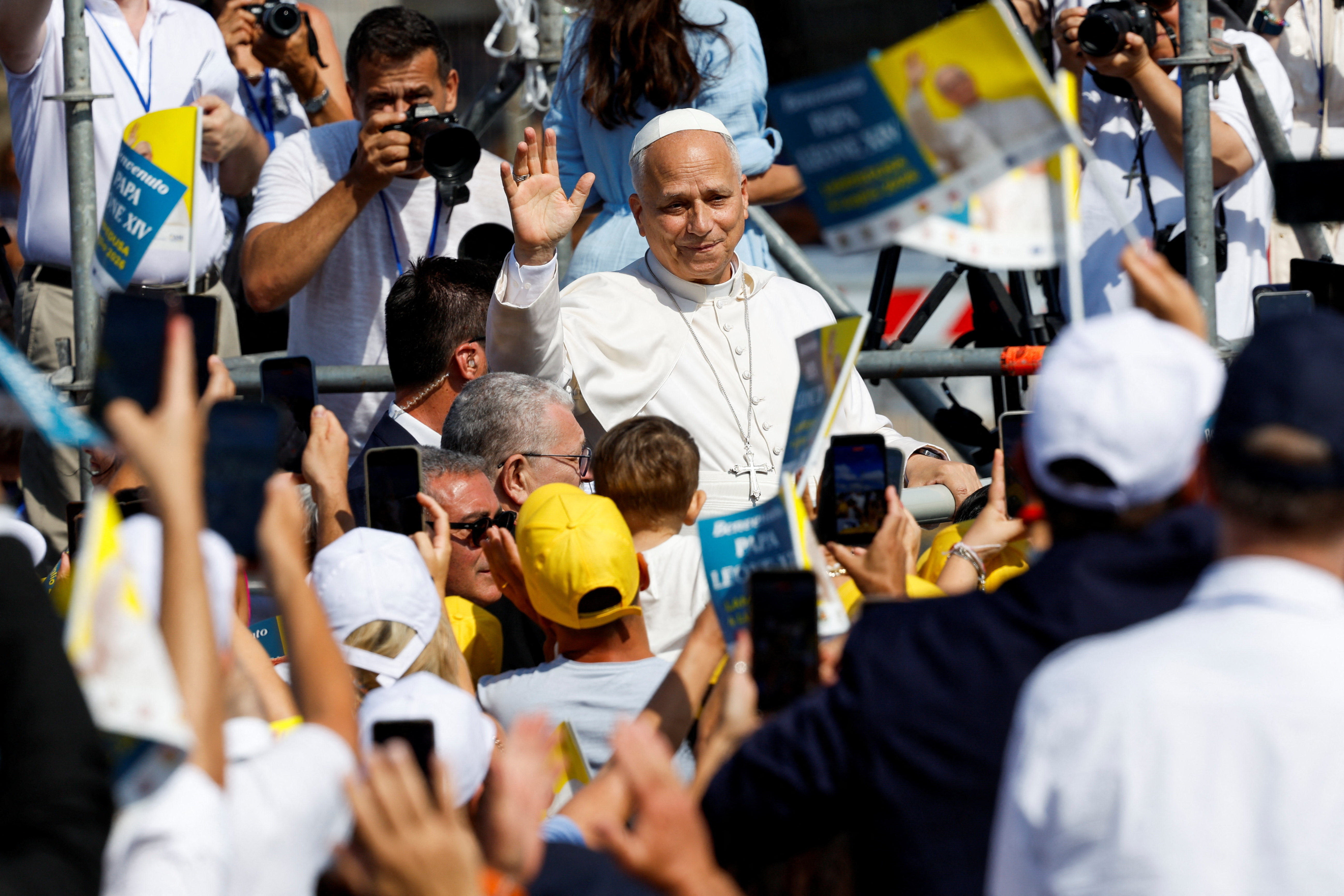 Pope Leo greets faithful, as he arrives to celebrate Holy Mass, as he visits the island of Lampedusa, a key entry point for migrants crossing the Mediterranean Sea, during a pastoral trip, Italy, July 4, 2026. REUTERS/Remo Casilli