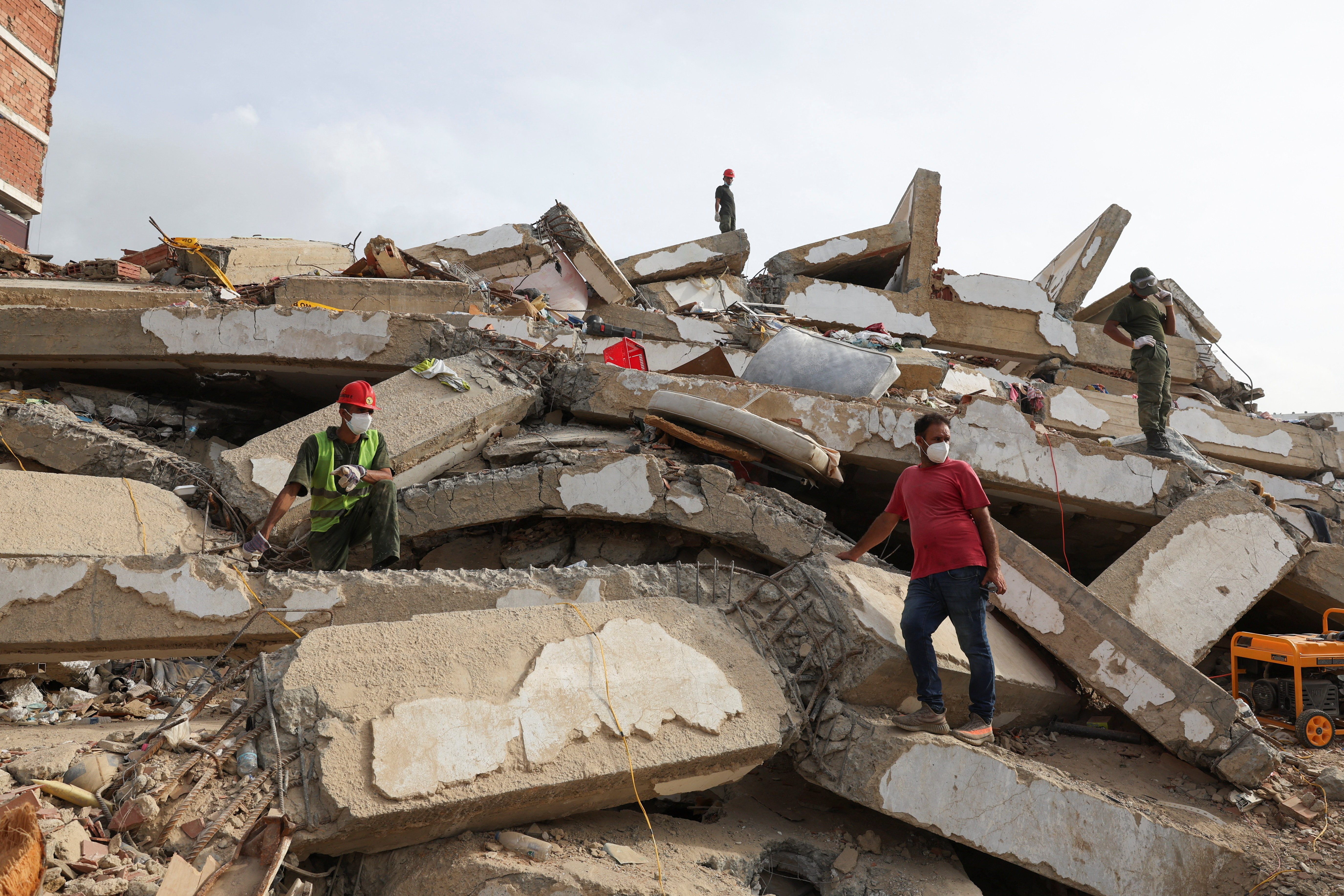 Rescuers work at the site of a collapsed building in the aftermath of the June 24 earthquakes, in La Guaira, Venezuela, July 4, 2026. REUTERS/Ricardo Arduengo