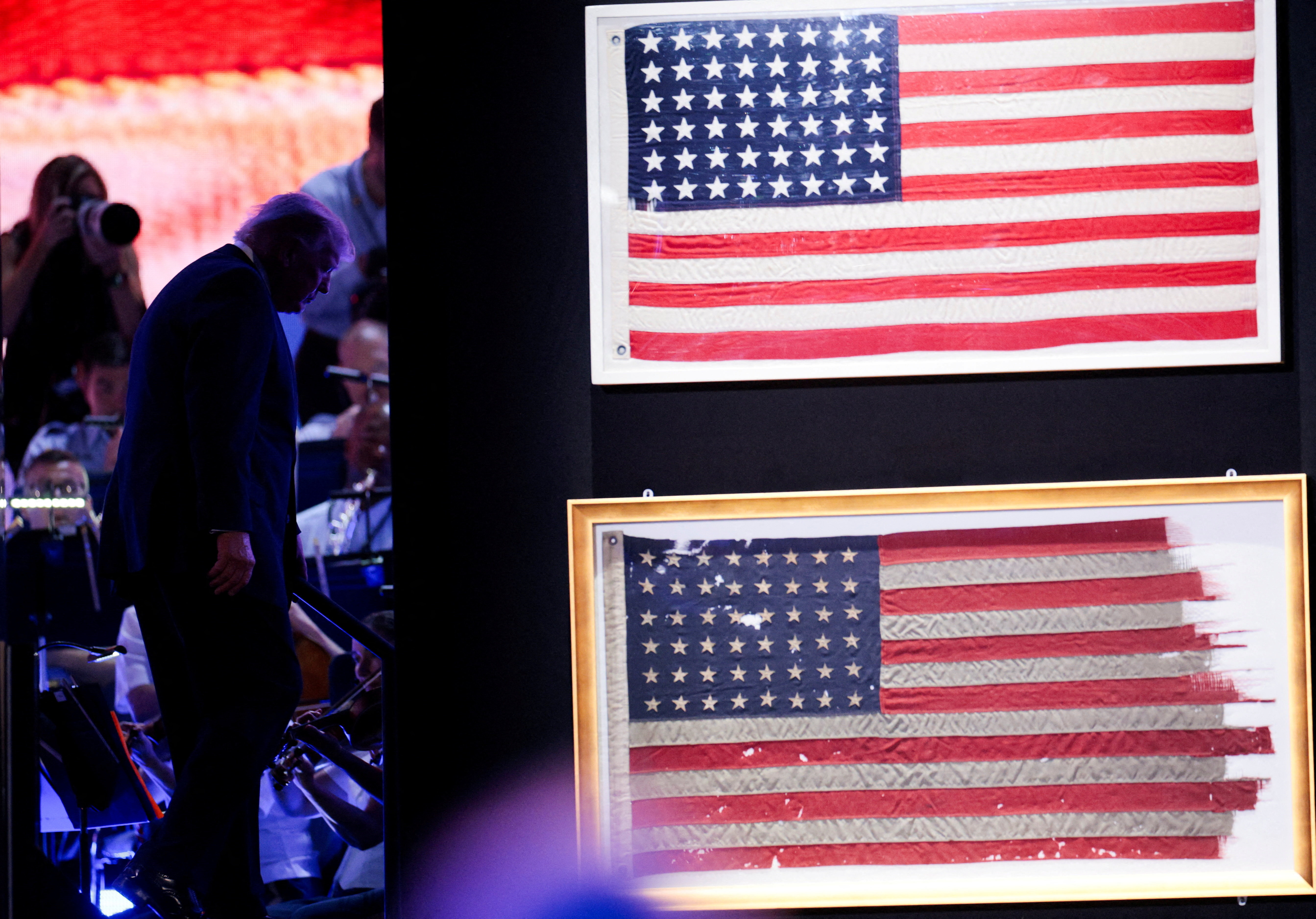 U.S. President Donald Trump walks off the stage after speaking at a Fourth of July rally, marking the 250th anniversary of U.S. independence, on the National Mall in Washington, D.C., U.S., July 4, 2026. REUTERS/Evan Vucci     TPX IMAGES OF THE DAY