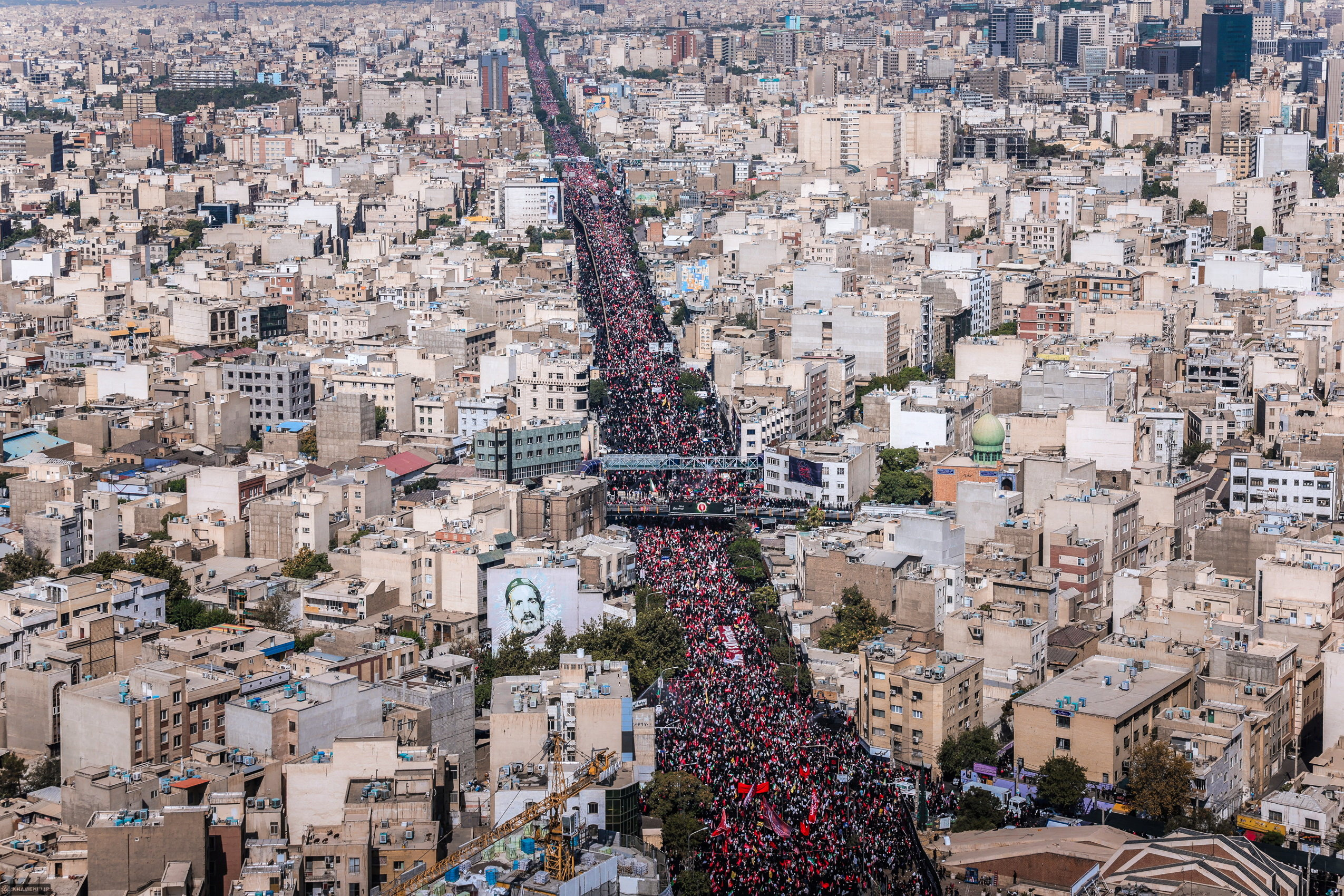 People attend a funeral procession for Iran's late Supreme Leader Ayatollah Ali Khamenei, who was killed on February 28 in Israeli and U.S. airstrikes